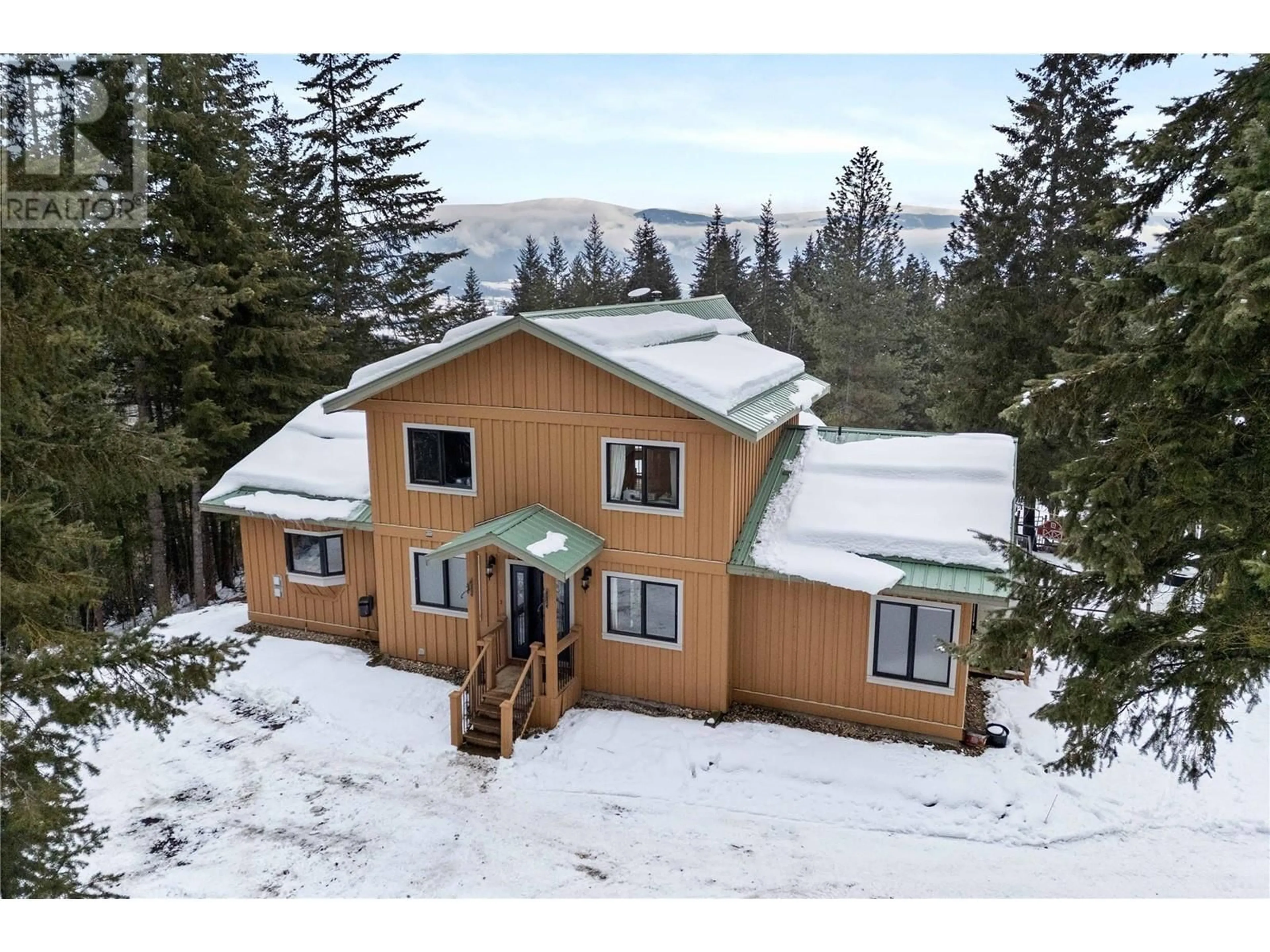 A pic from outside/outdoor area/front of a property/back of a property/a pic from drone, mountain view for 65 FURLONG ROAD, Enderby British Columbia V0E1V3