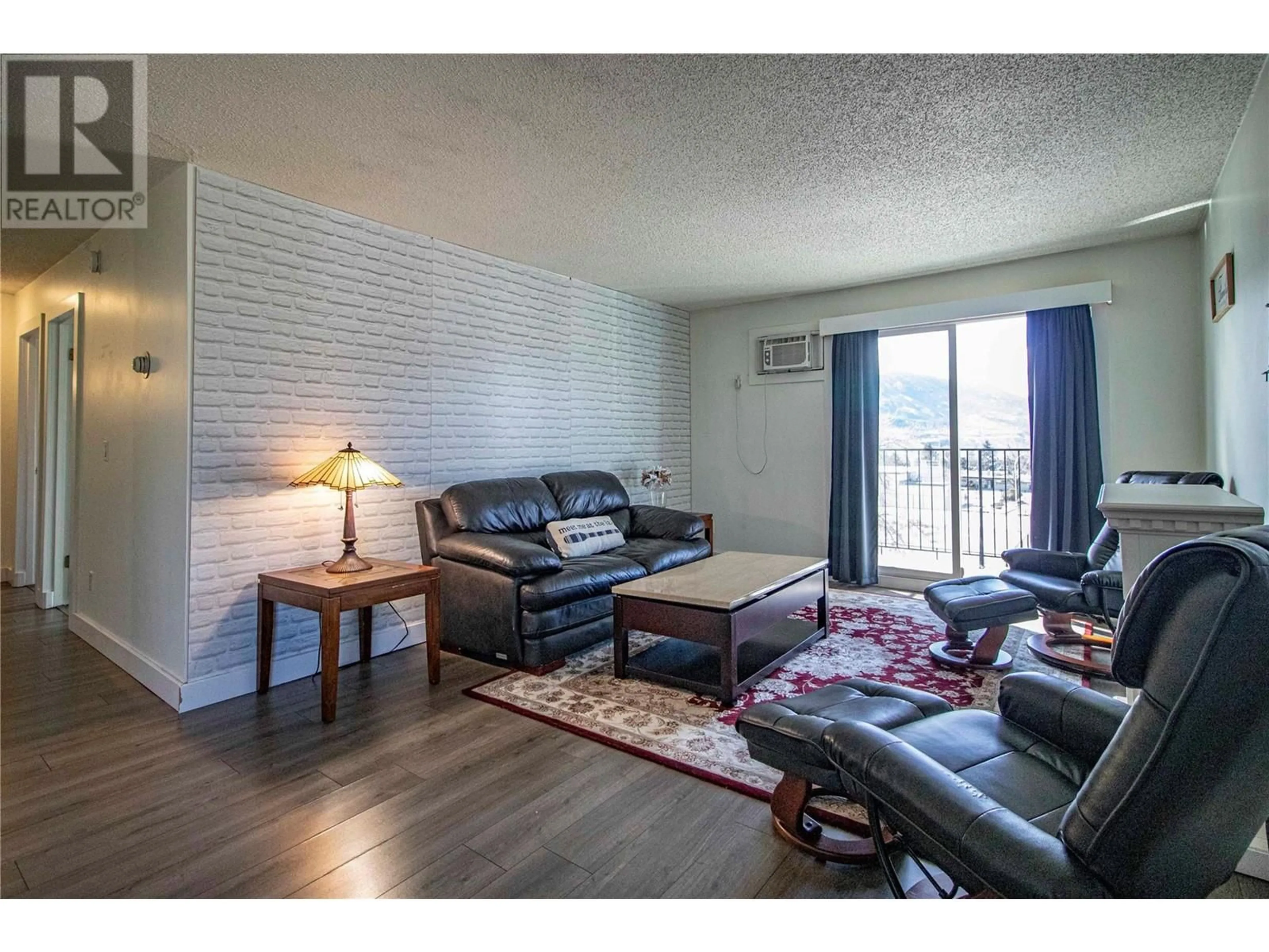Living room with furniture, wood/laminate floor for 301 - 1300 CHURCH STREET, Penticton British Columbia V2A4R8