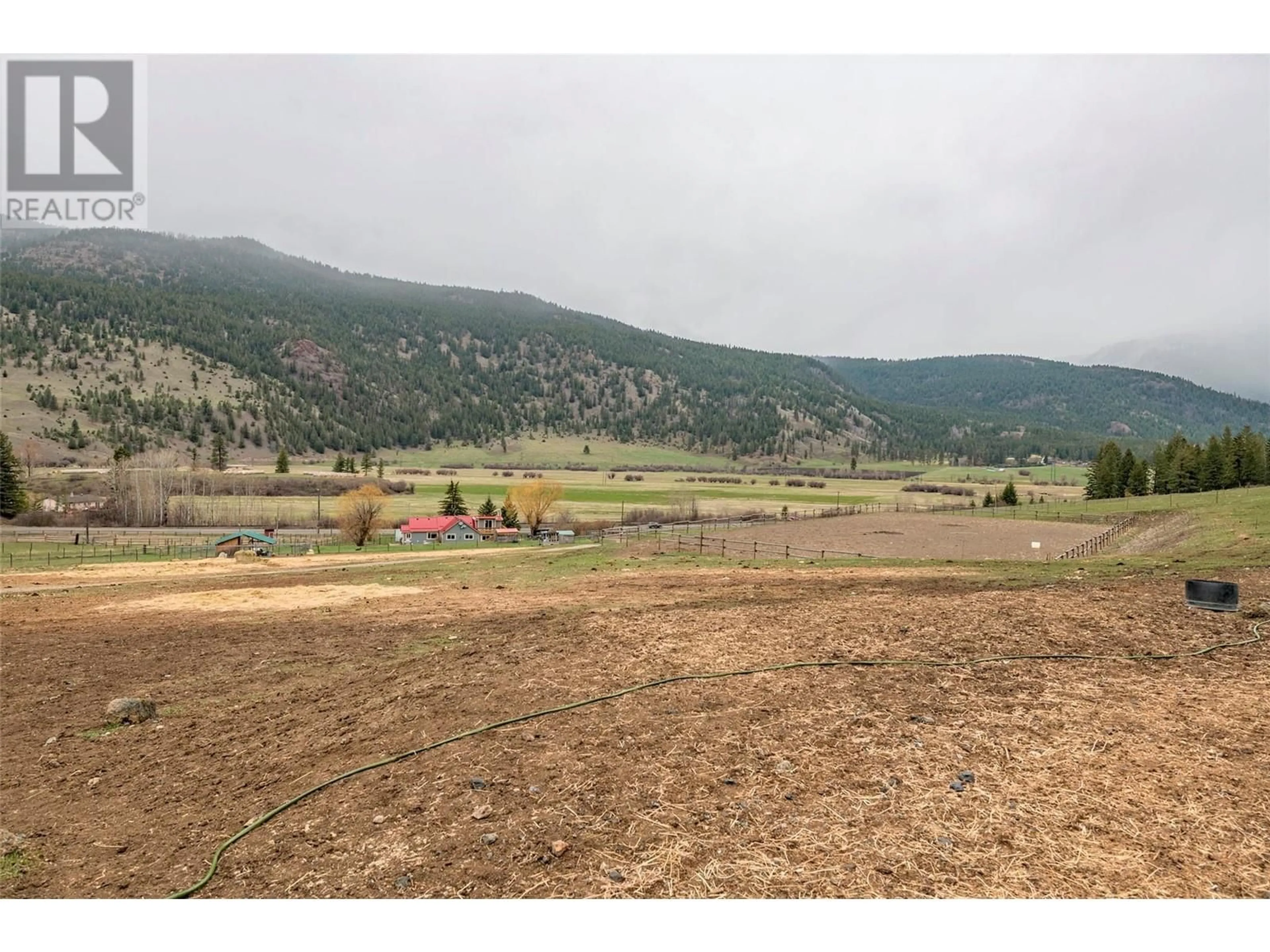 A pic from outside/outdoor area/front of a property/back of a property/a pic from drone, mountain view for 6449 97 HIGHWAY, Falkland British Columbia V0E1W0