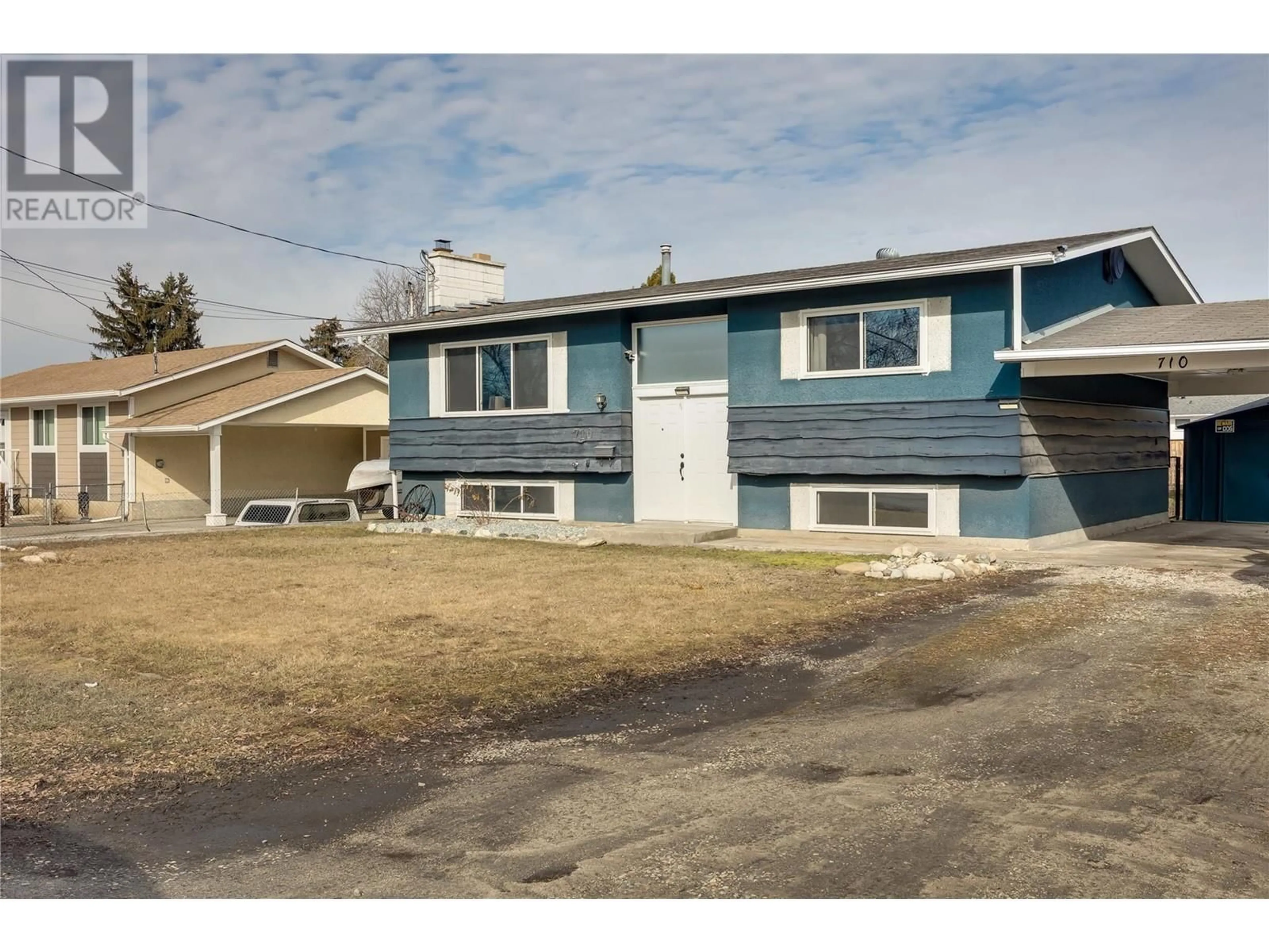 Home with vinyl exterior material, street for 710 HOLLYDELL ROAD, Kelowna British Columbia V1X1L5