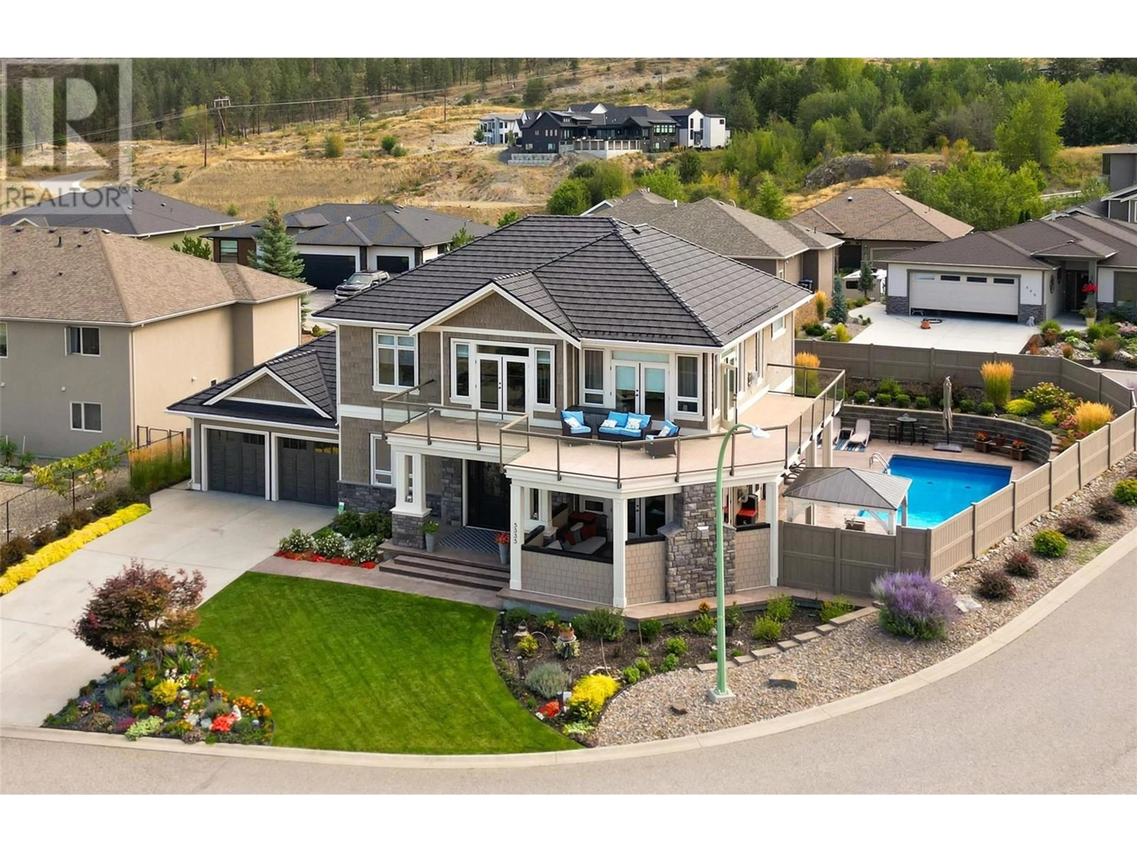 A pic from outside/outdoor area/front of a property/back of a property/a pic from drone, mountain view for 5335 SIGNET CRESCENT, Kelowna British Columbia V1W5J5