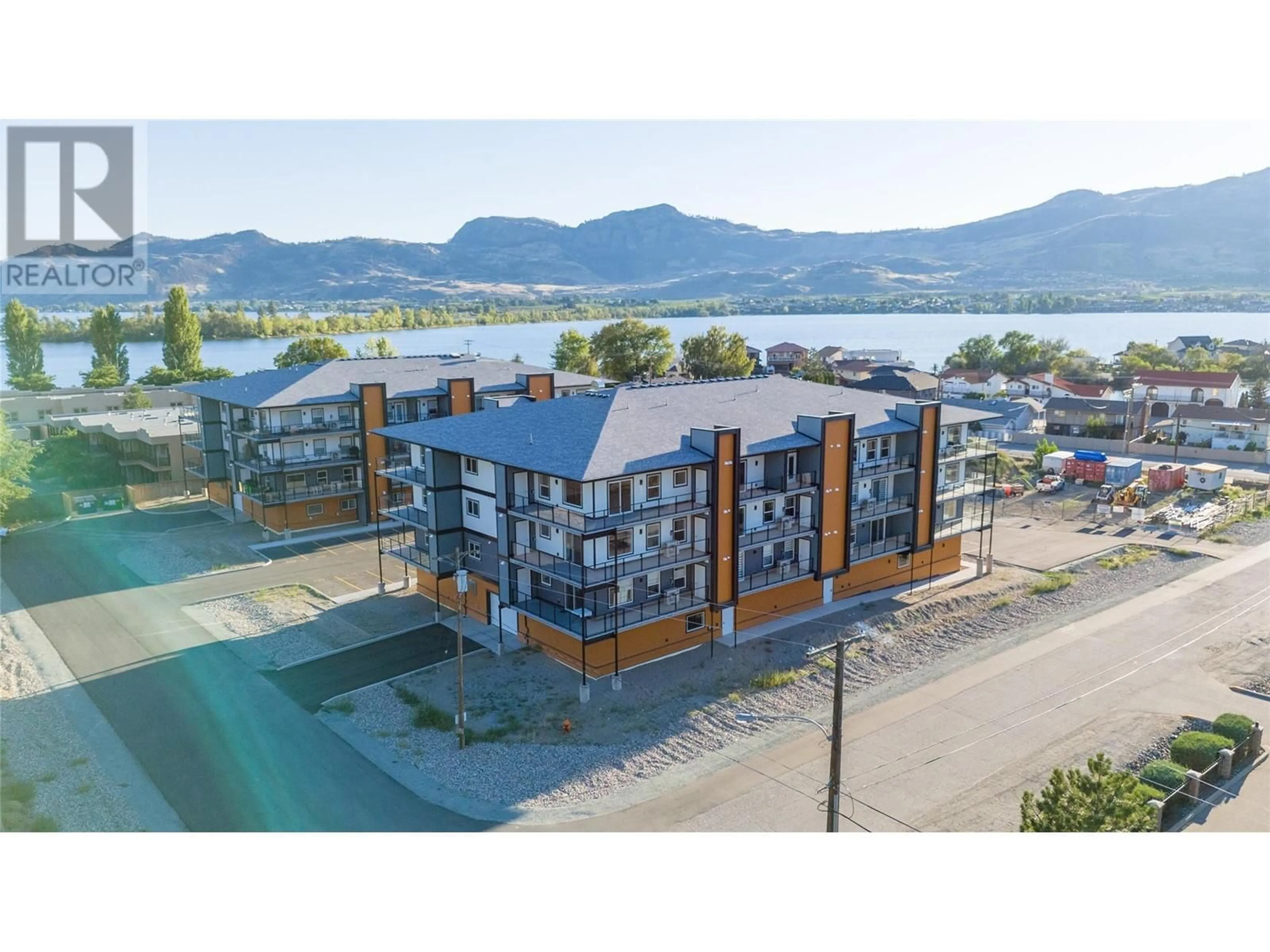 A pic from outside/outdoor area/front of a property/back of a property/a pic from drone, water/lake/river/ocean view for 404 - 5620 51ST STREET, Osoyoos British Columbia V0H1V6