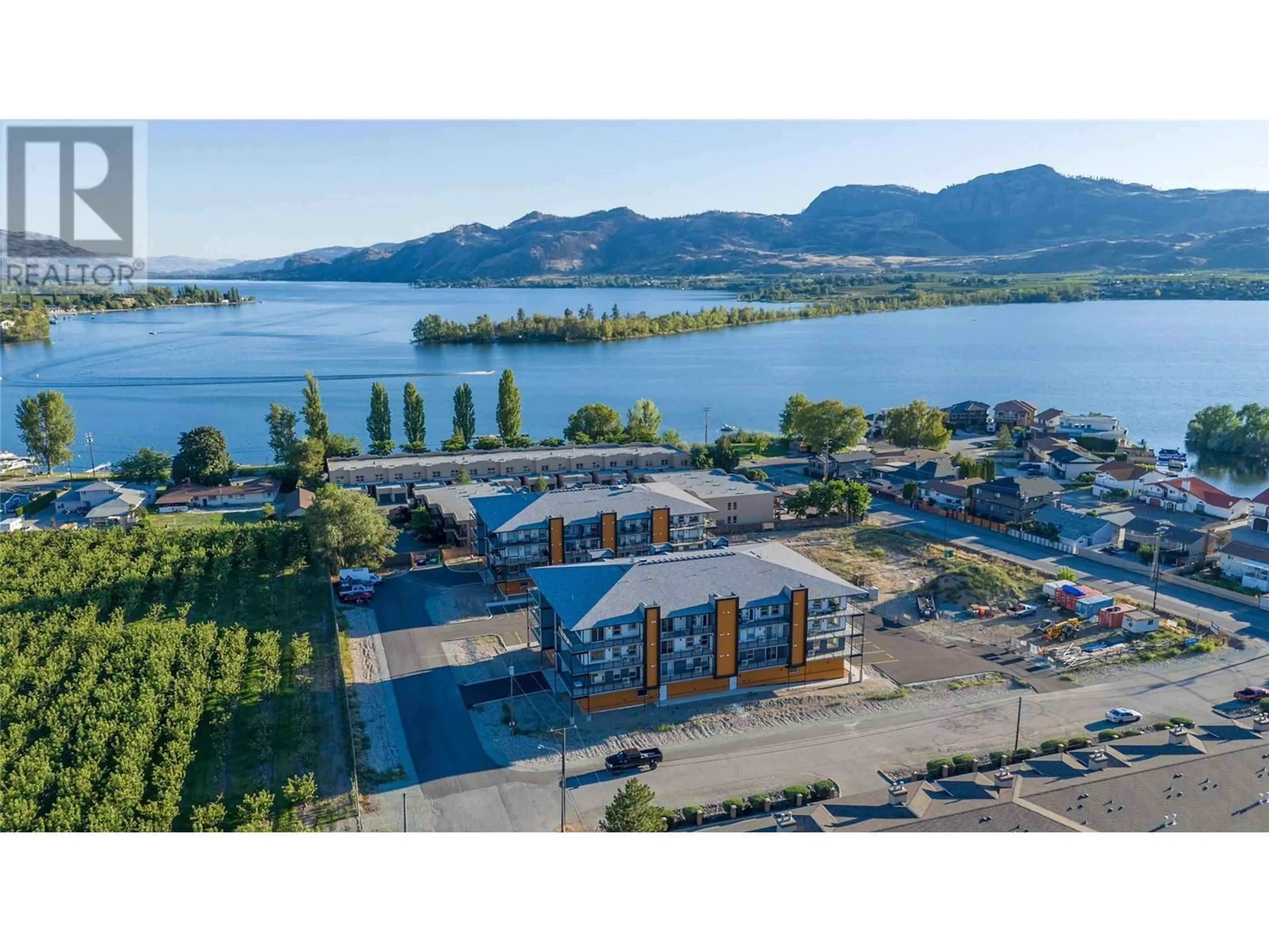 A pic from outside/outdoor area/front of a property/back of a property/a pic from drone, water/lake/river/ocean view for 404 - 5620 51ST STREET, Osoyoos British Columbia V0H1V6