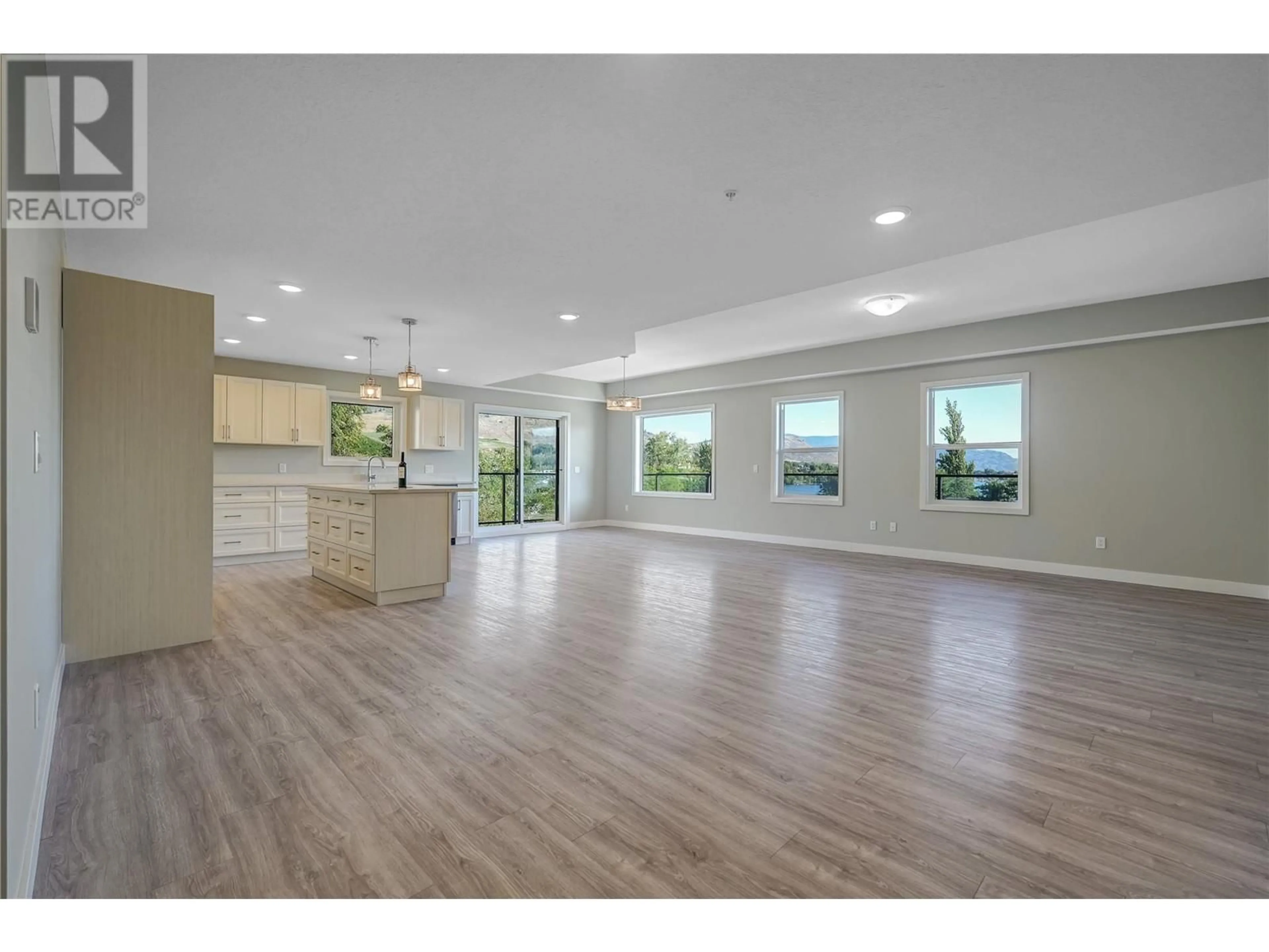 Open concept kitchen, wood/laminate floor for 404 - 5620 51ST STREET, Osoyoos British Columbia V0H1V6