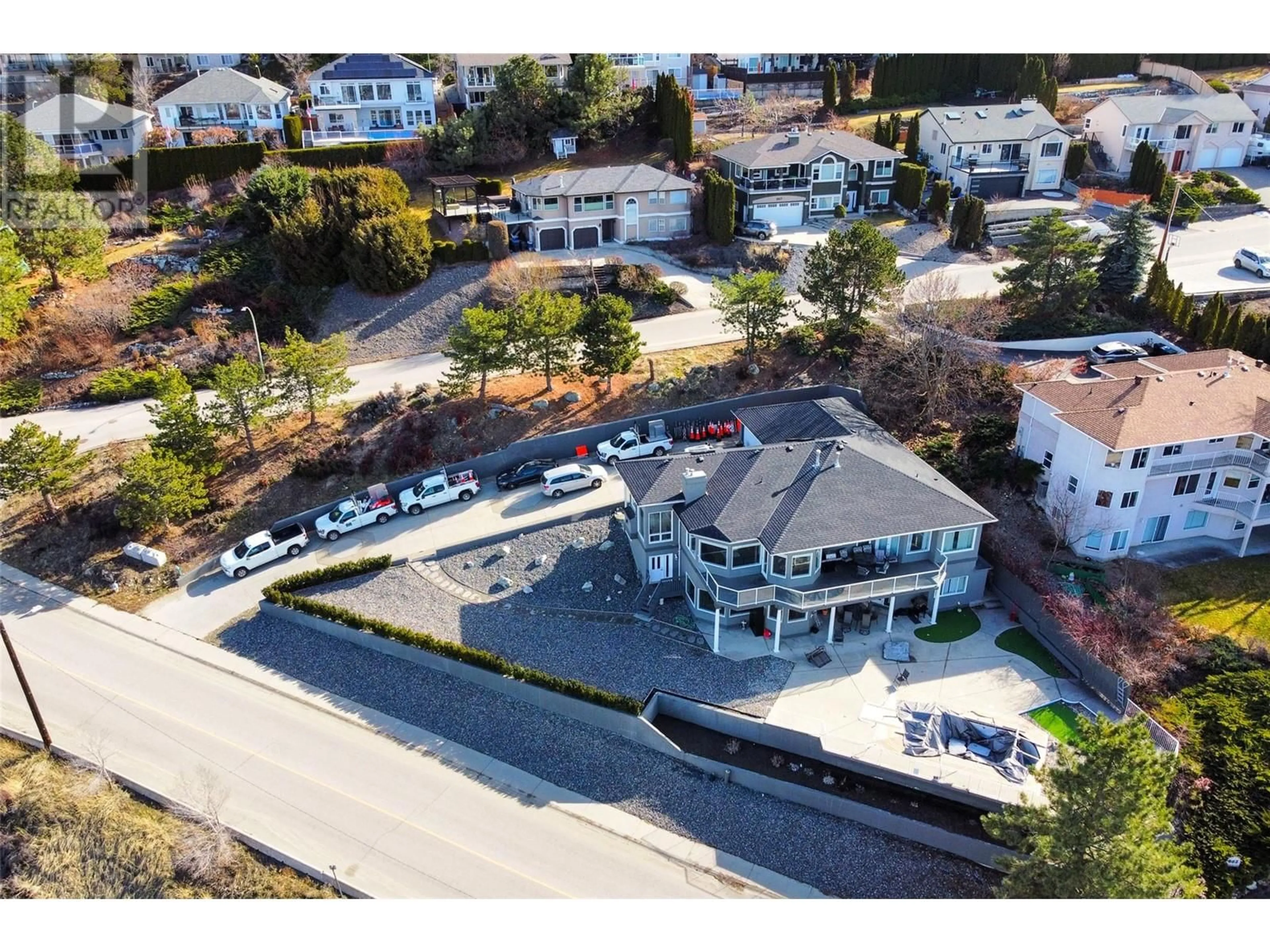 A pic from outside/outdoor area/front of a property/back of a property/a pic from drone, street for 845 Toovey Road, Kelowna British Columbia V1X6P9