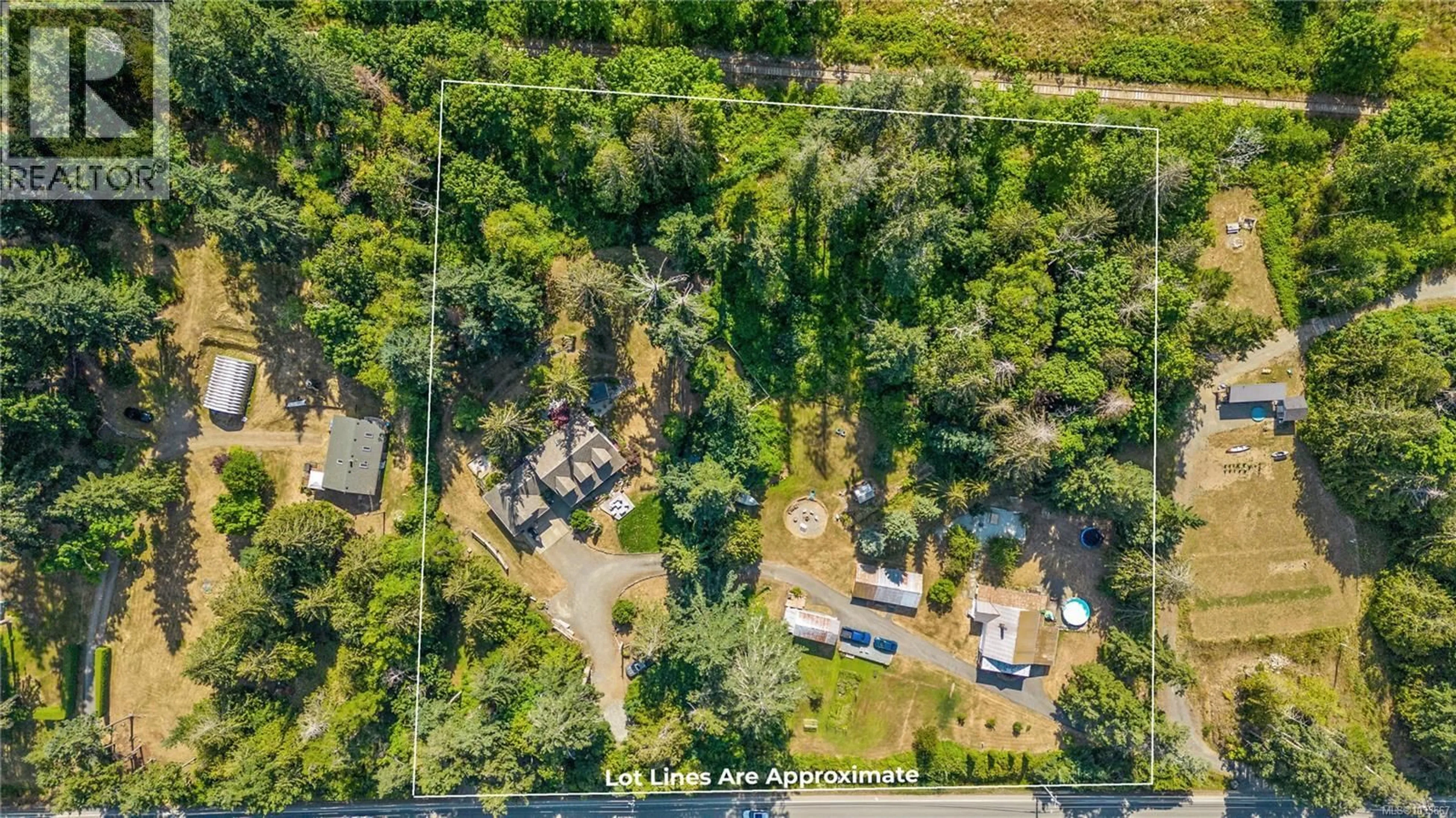 A pic from outside/outdoor area/front of a property/back of a property/a pic from drone, forest/trees view for 6249/6259 ISLAND HIGHWAY SOUTH, Union Bay British Columbia V0R3B0