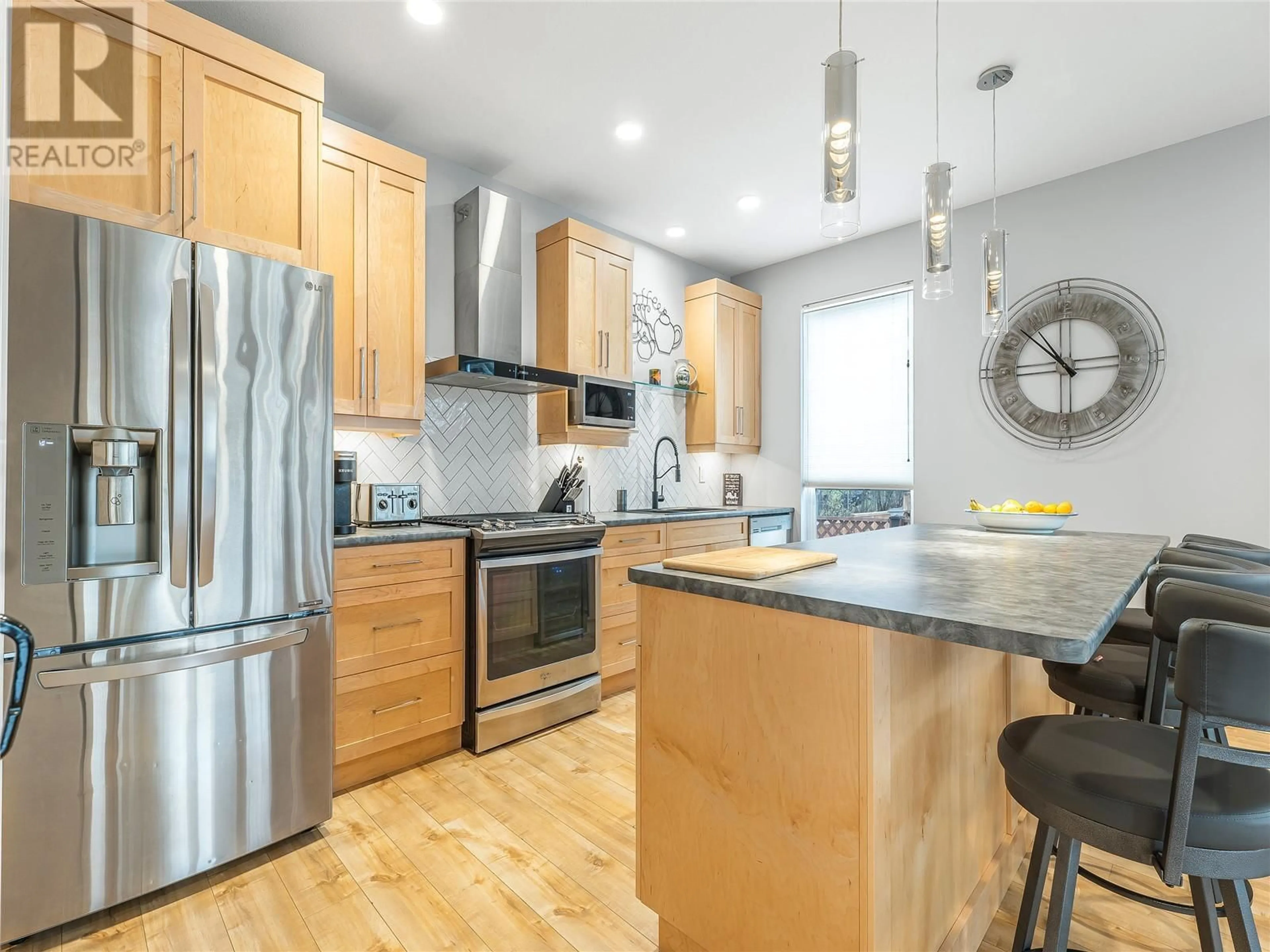 Open concept kitchen, wood/laminate floor for 4204 14 Avenue, Vernon British Columbia V1H1J2