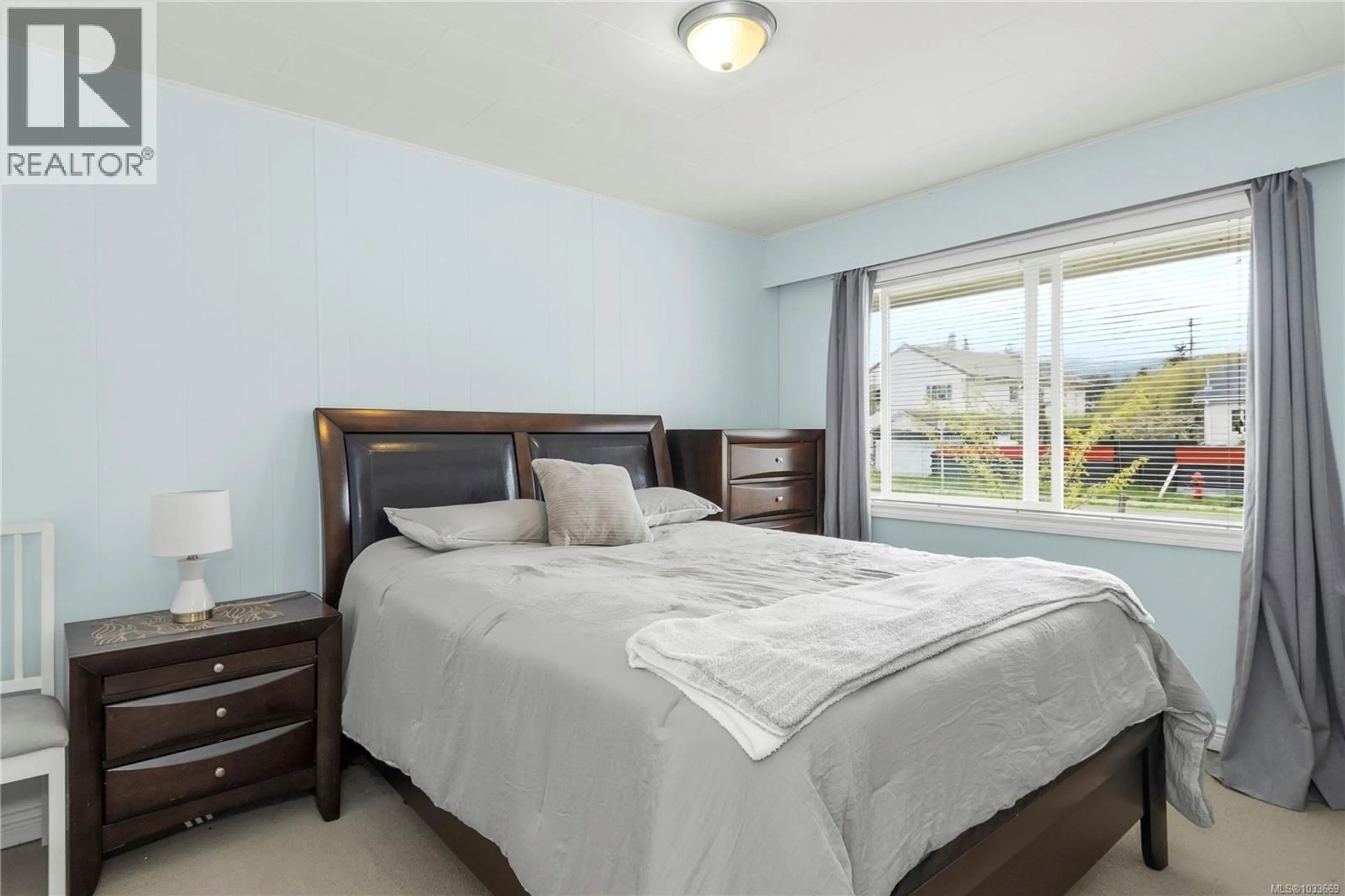 Bedroom with bed, wood/laminate floor for 3402 BEVAN ROAD, Cumberland British Columbia V0R1S0