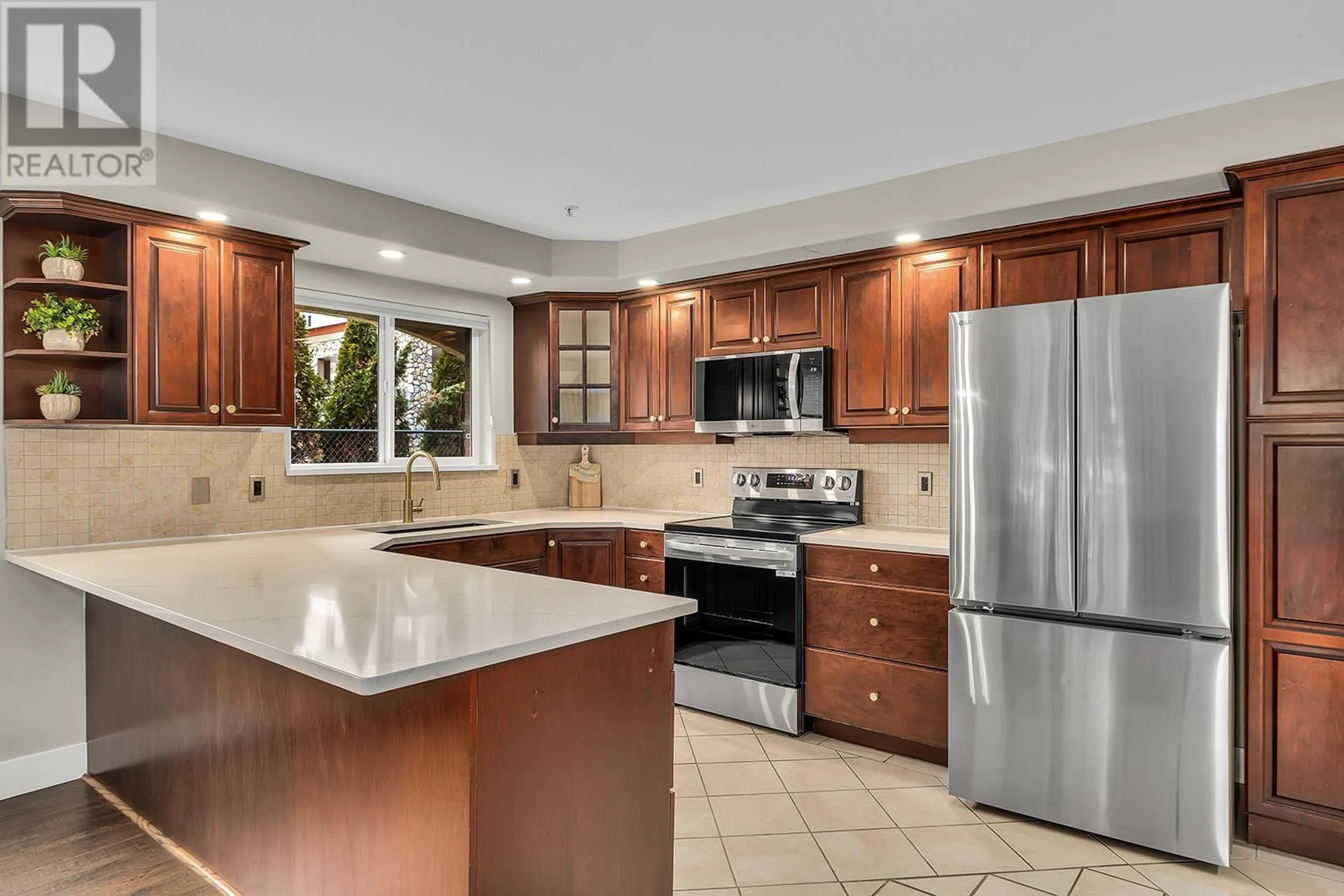 Open concept kitchen, ceramic/tile floor for 1950 Durnin Road Unit# 101, Kelowna British Columbia V1X7W6