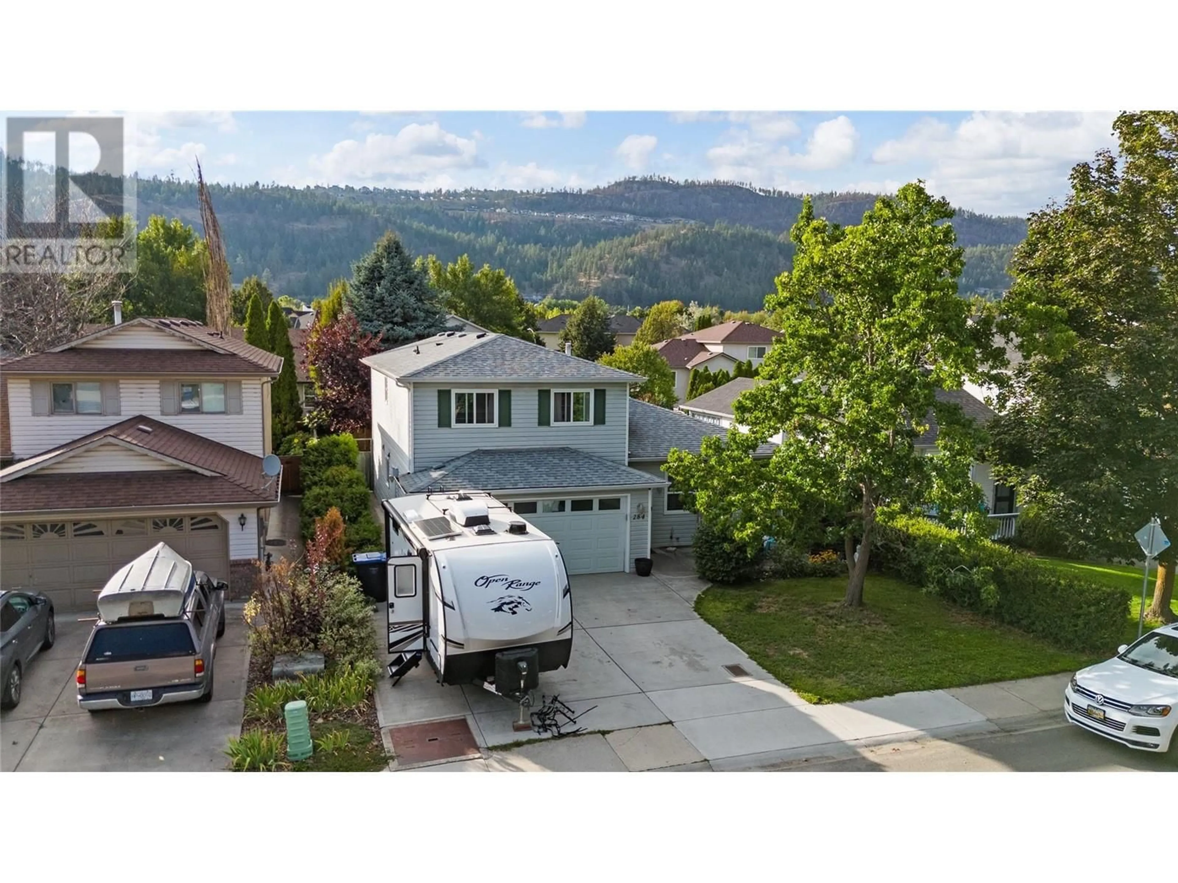 A pic from outside/outdoor area/front of a property/back of a property/a pic from drone, street for 284 Drysdale Boulevard, Kelowna British Columbia V1V1P5