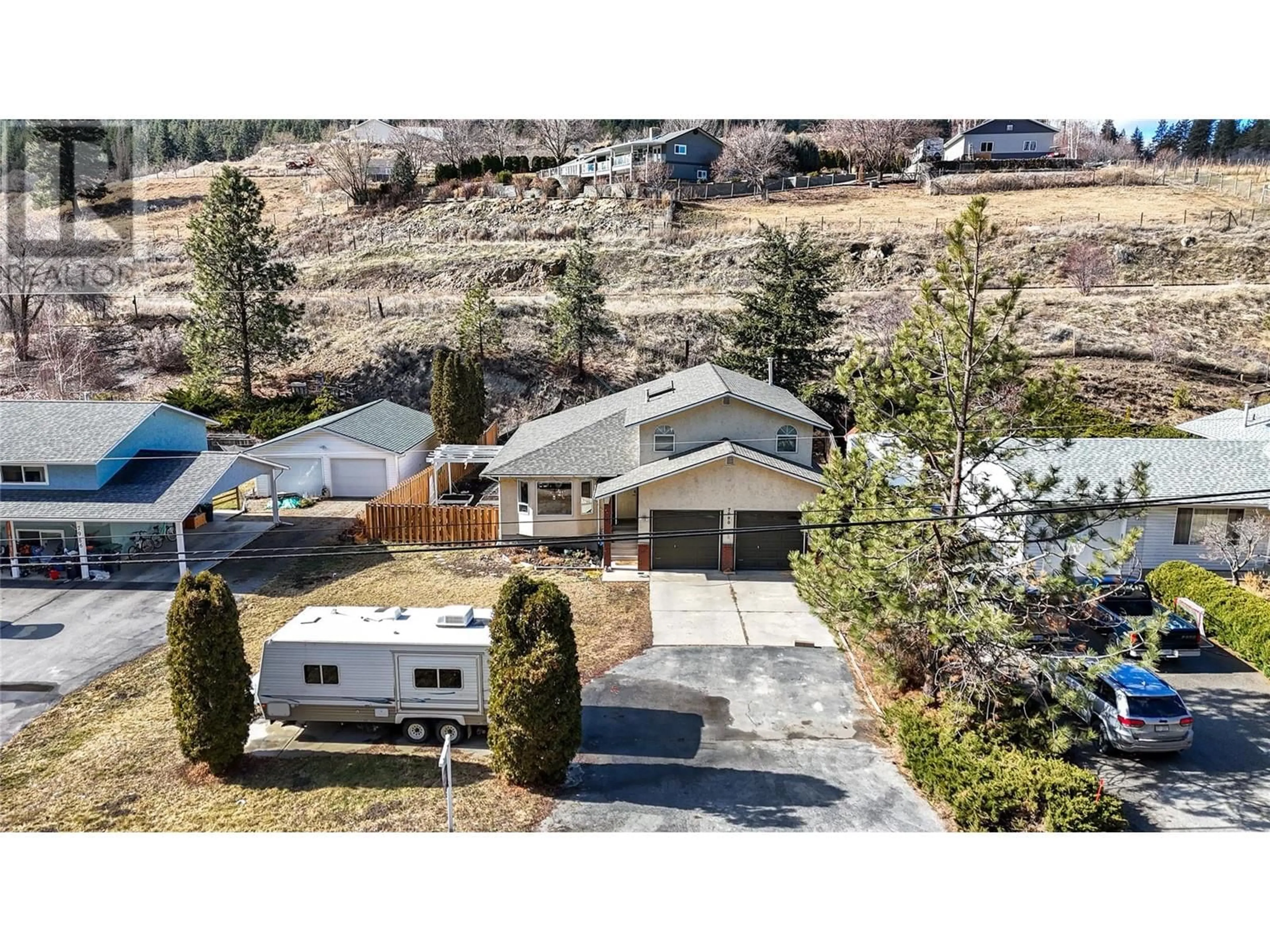 A pic from outside/outdoor area/front of a property/back of a property/a pic from drone, street for 7990 VICTORIA ROAD SOUTH, Summerland British Columbia V0H1Z2