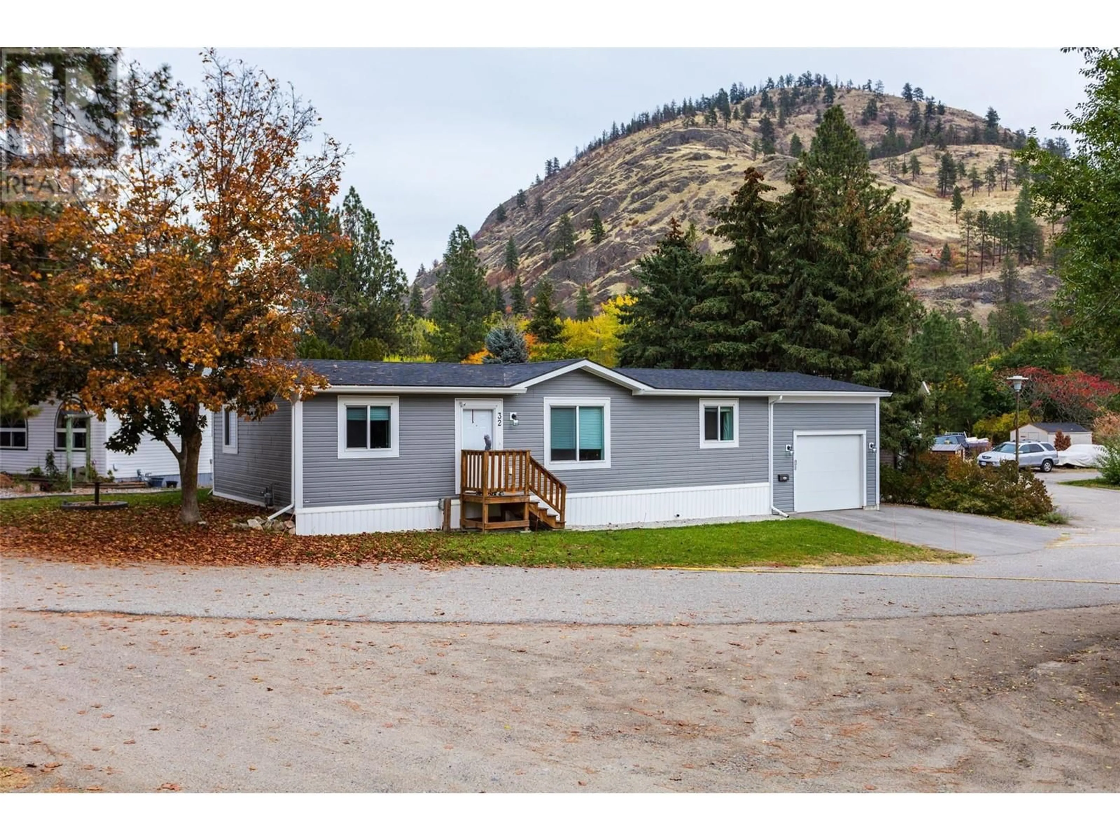 Home with vinyl exterior material, mountain view for 1999 Highway 97 S Unit# 32, West Kelowna British Columbia V1Z1B2