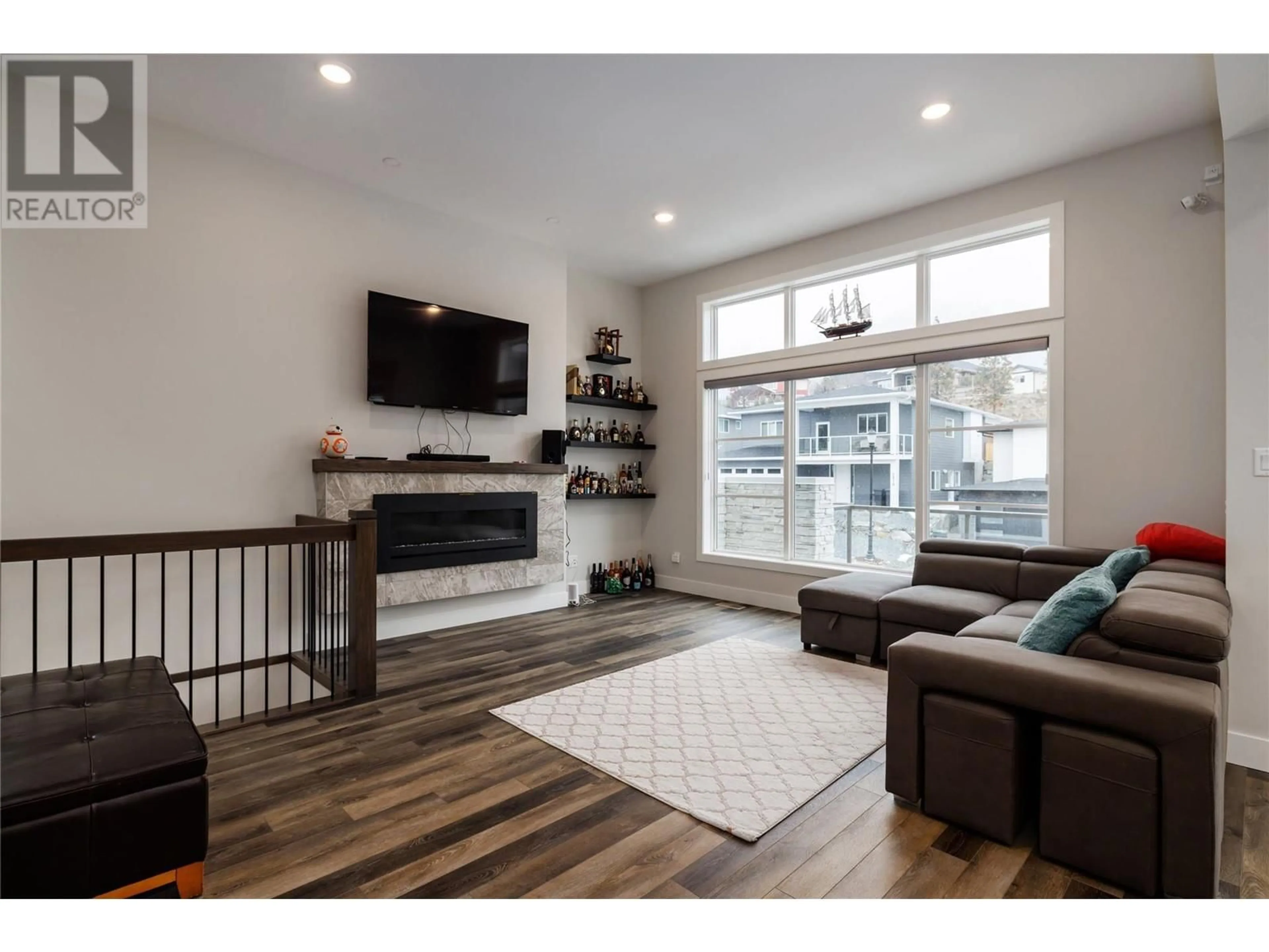 Living room with furniture, wood/laminate floor for 2811 CANYON CREST DRIVE, West Kelowna British Columbia V4T0E3