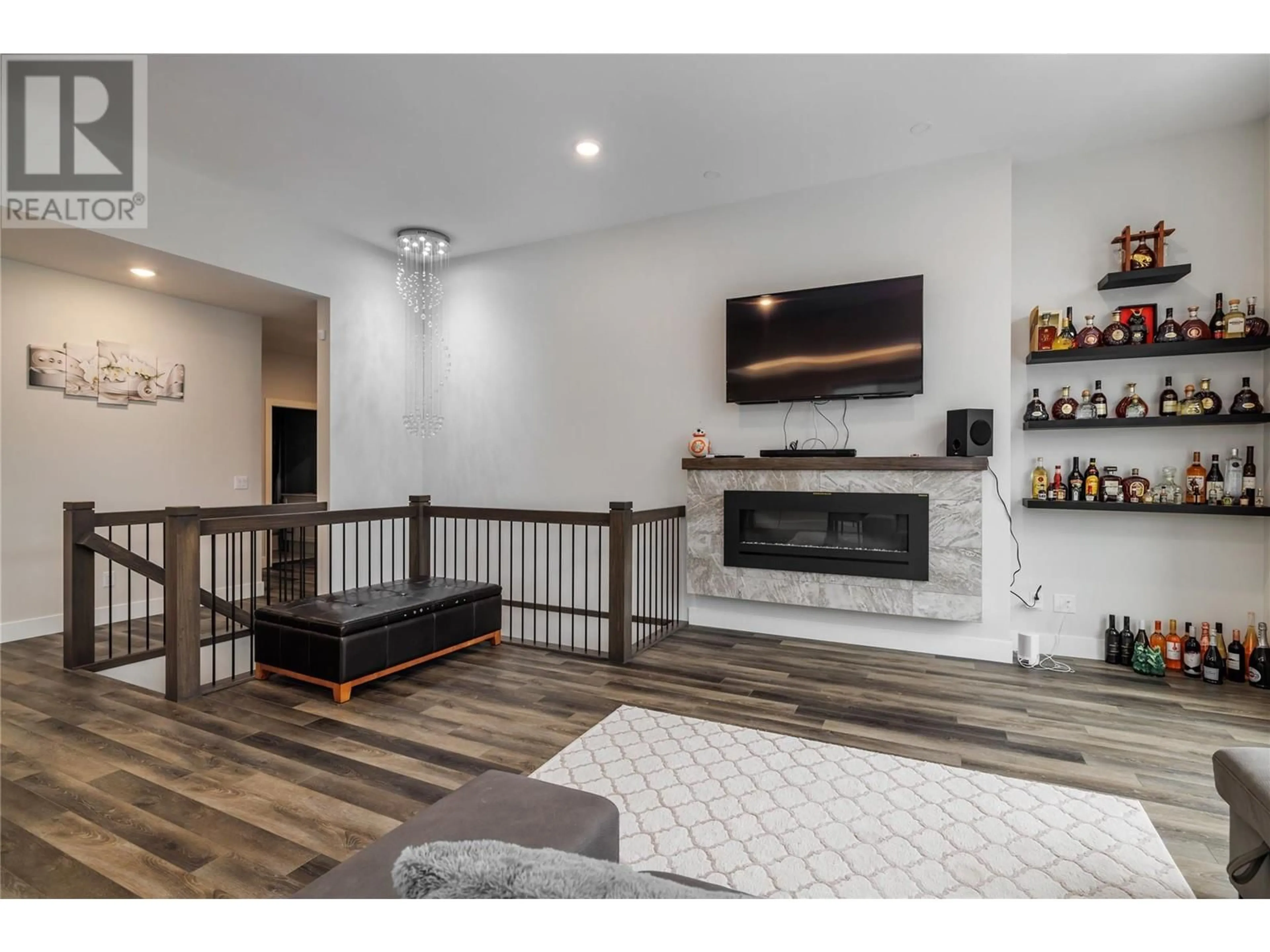 Living room with furniture, wood/laminate floor for 2811 Canyon Crest Drive, West Kelowna British Columbia V4T0E3