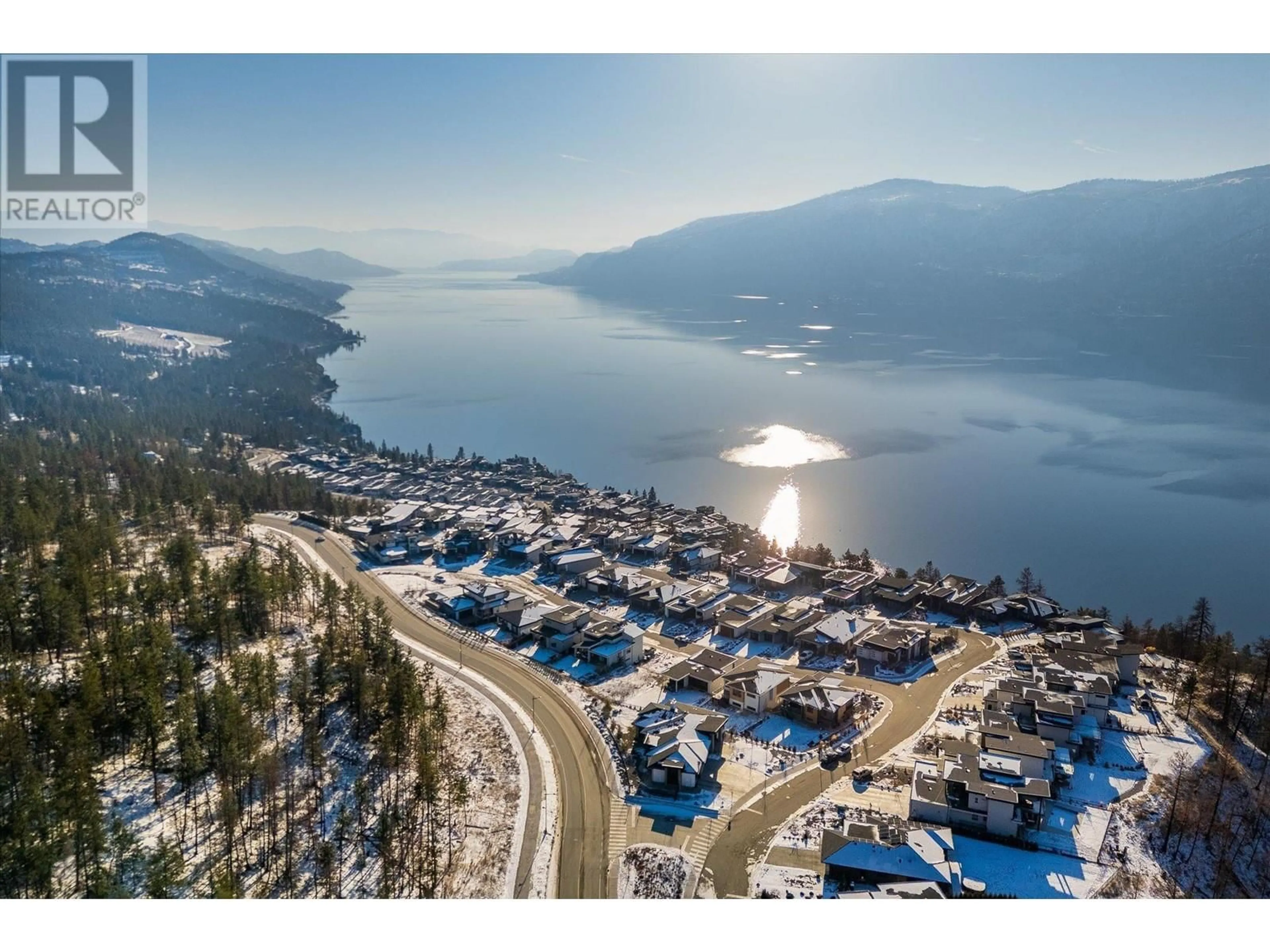 A pic from outside/outdoor area/front of a property/back of a property/a pic from drone, mountain view for 9489 Ledgestone Road, Lake Country British Columbia V4V0A4