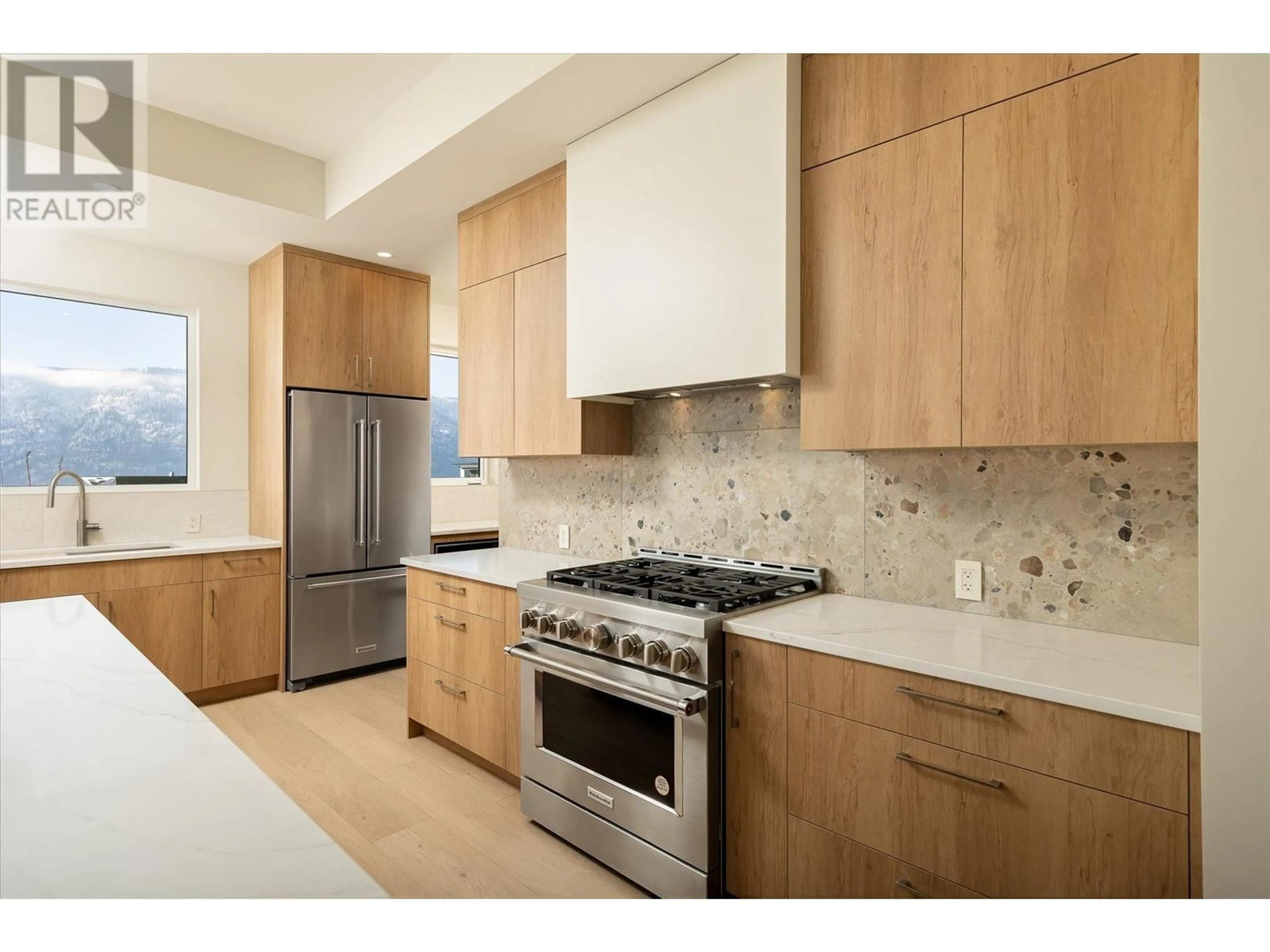 Contemporary kitchen, ceramic/tile floor for 9489 Ledgestone Road, Lake Country British Columbia V4V0A4