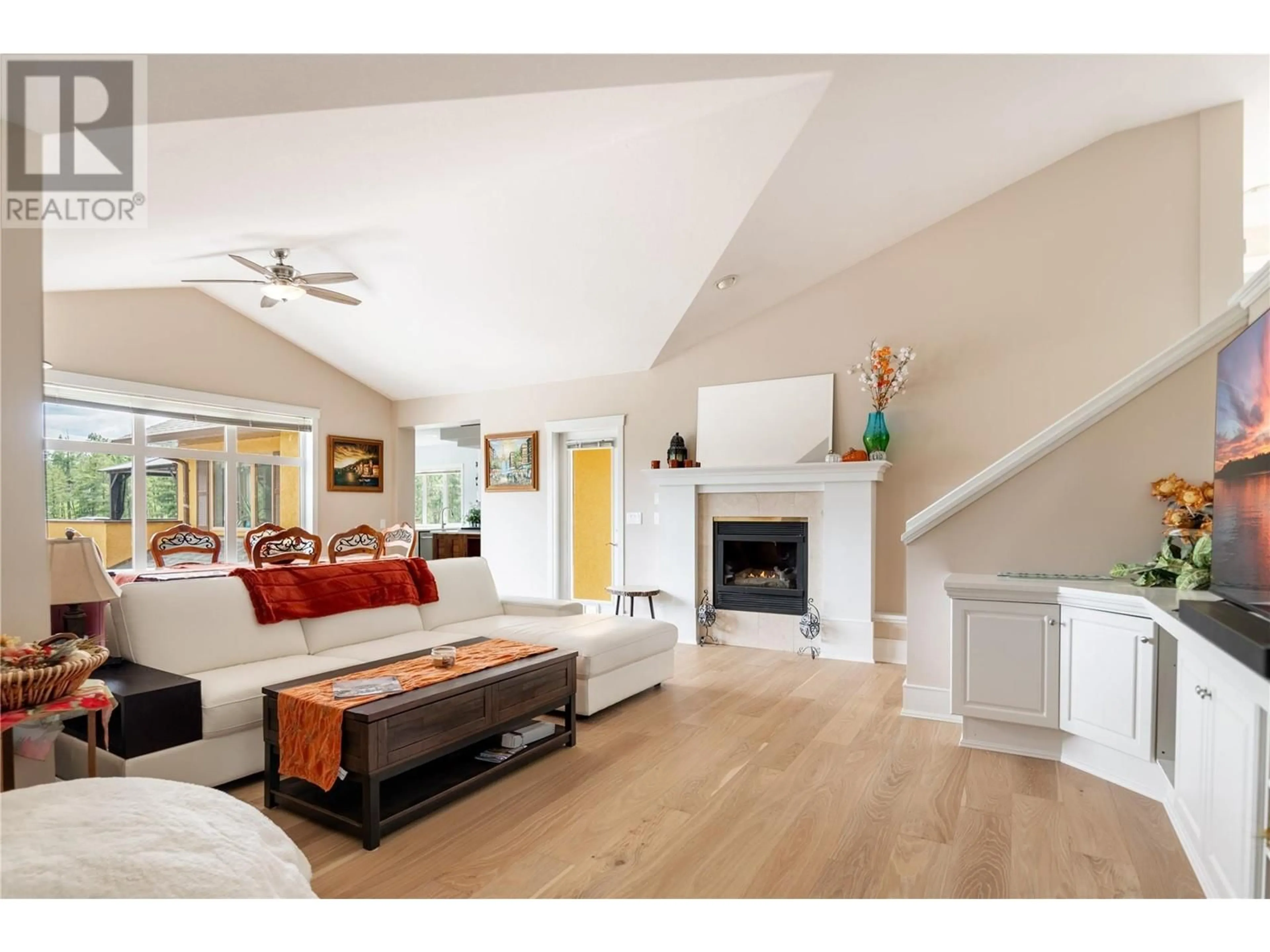 Living room with furniture, wood/laminate floor for 2325 LILLOOET CRESCENT, Kelowna British Columbia V1V1T1