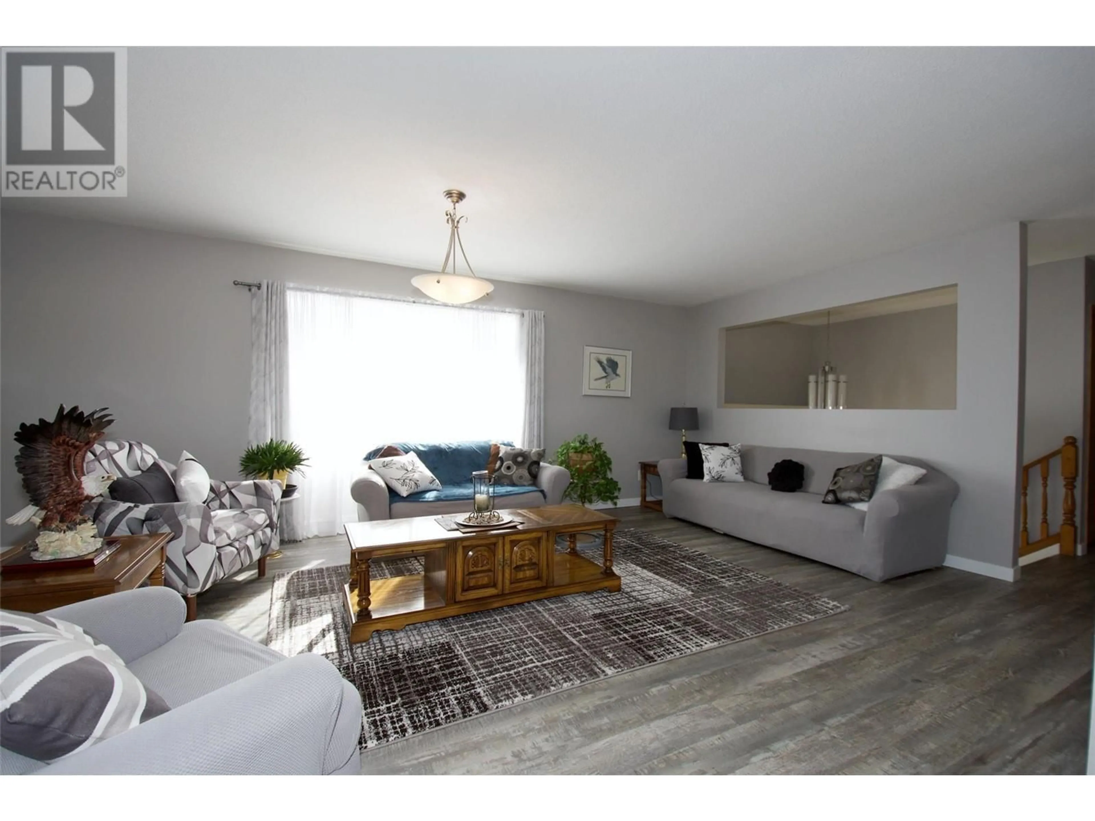 Living room with furniture, wood/laminate floor for 3795 SALLOUM ROAD, West Kelowna British Columbia V4T1E2