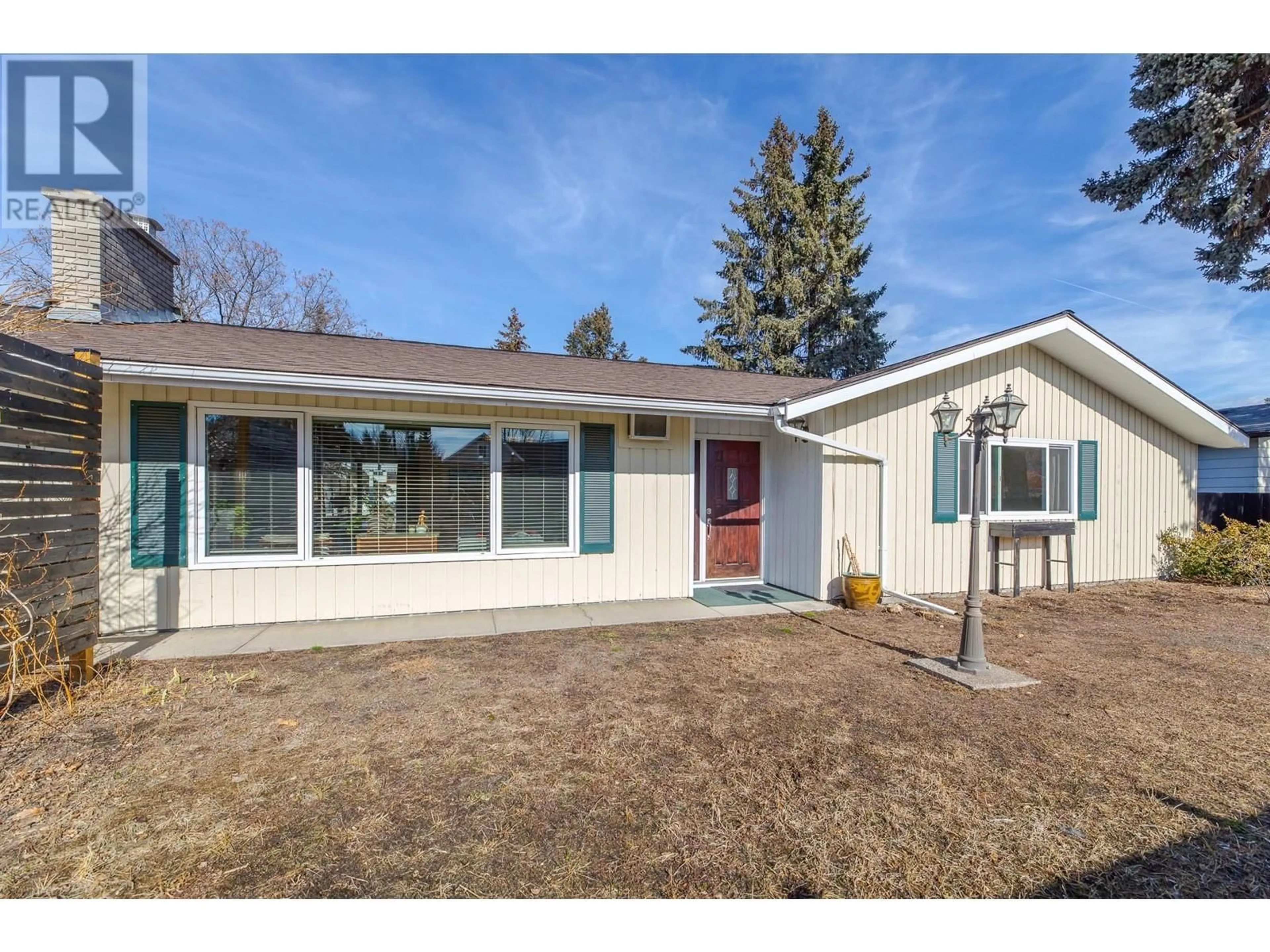 Home with vinyl exterior material, street for 10114 PRAIRIE VALLEY ROAD, Summerland British Columbia V0H1Z0