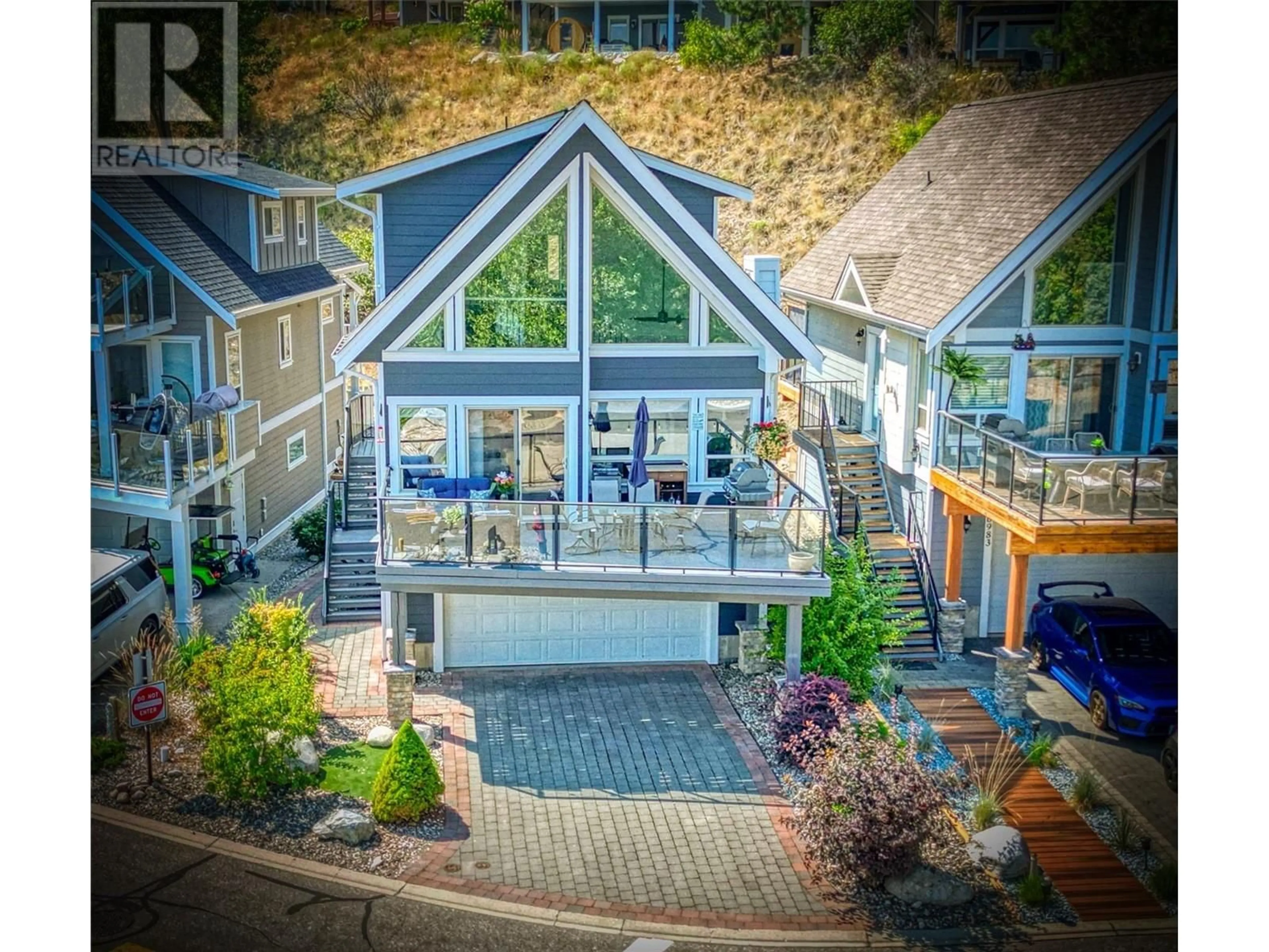 A pic from outside/outdoor area/front of a property/back of a property/a pic from drone, water/lake/river/ocean view for 24 - 6985 BARCELONA DRIVE, Kelowna British Columbia V1Z3R8