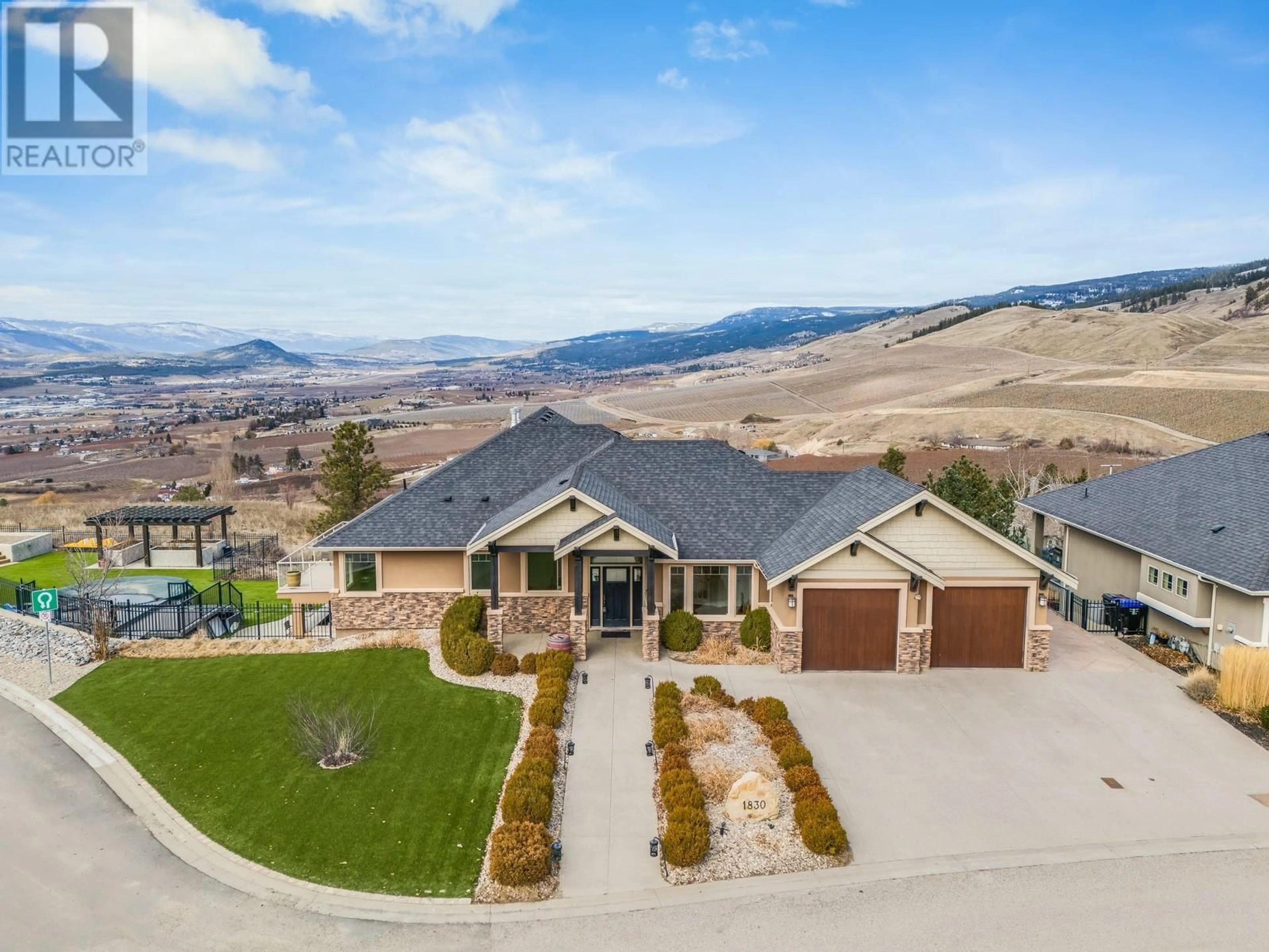 A pic from outside/outdoor area/front of a property/back of a property/a pic from drone, mountain view for 1830 Birkdale Avenue, Kelowna British Columbia V1P1R7