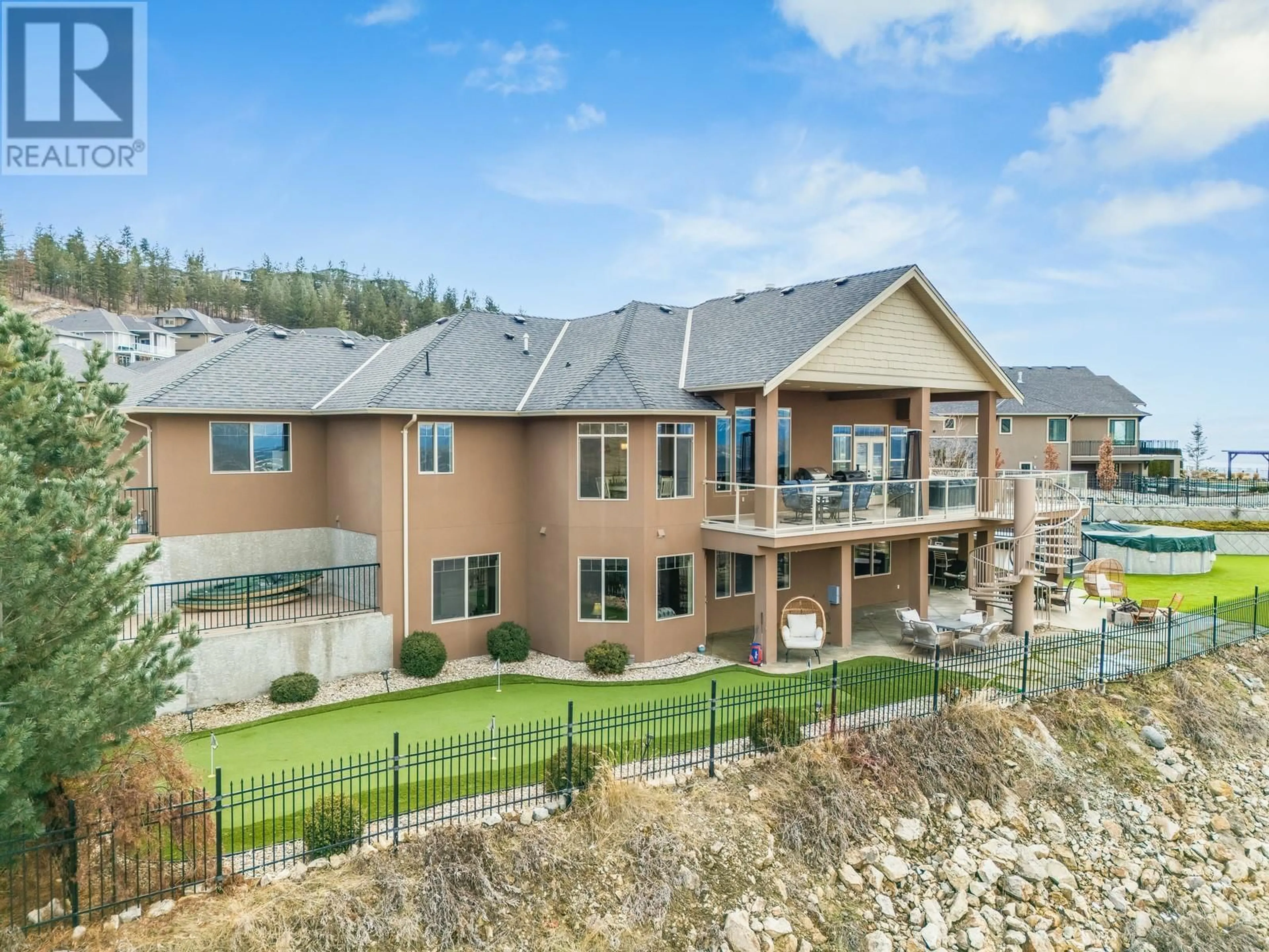 A pic from outside/outdoor area/front of a property/back of a property/a pic from drone, mountain view for 1830 Birkdale Avenue, Kelowna British Columbia V1P1R7