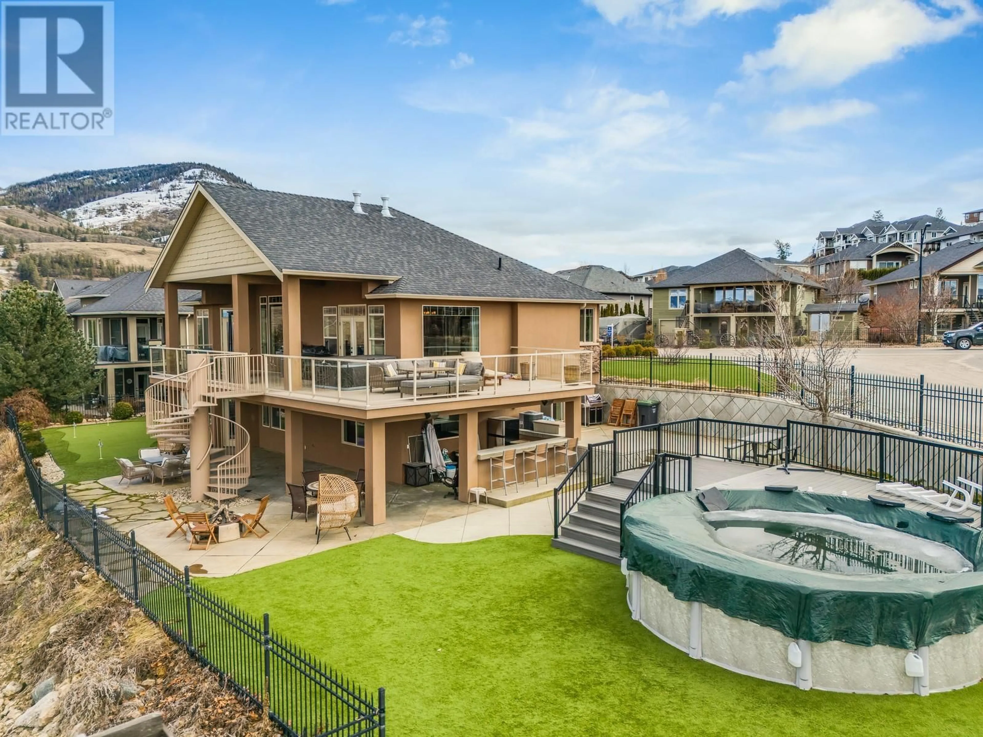 A pic from outside/outdoor area/front of a property/back of a property/a pic from drone, mountain view for 1830 Birkdale Avenue, Kelowna British Columbia V1P1R7