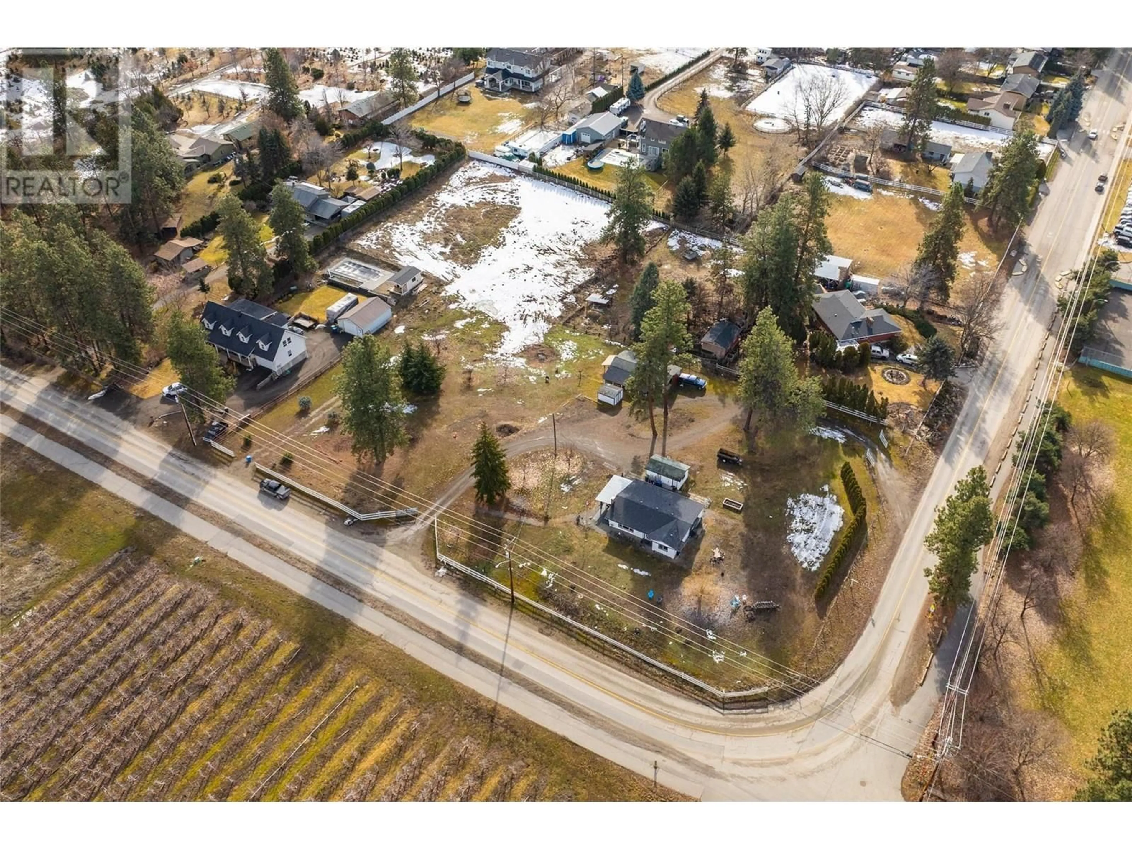 A pic from outside/outdoor area/front of a property/back of a property/a pic from drone, street for 4200 Spiers Road, Kelowna British Columbia V1W4B5