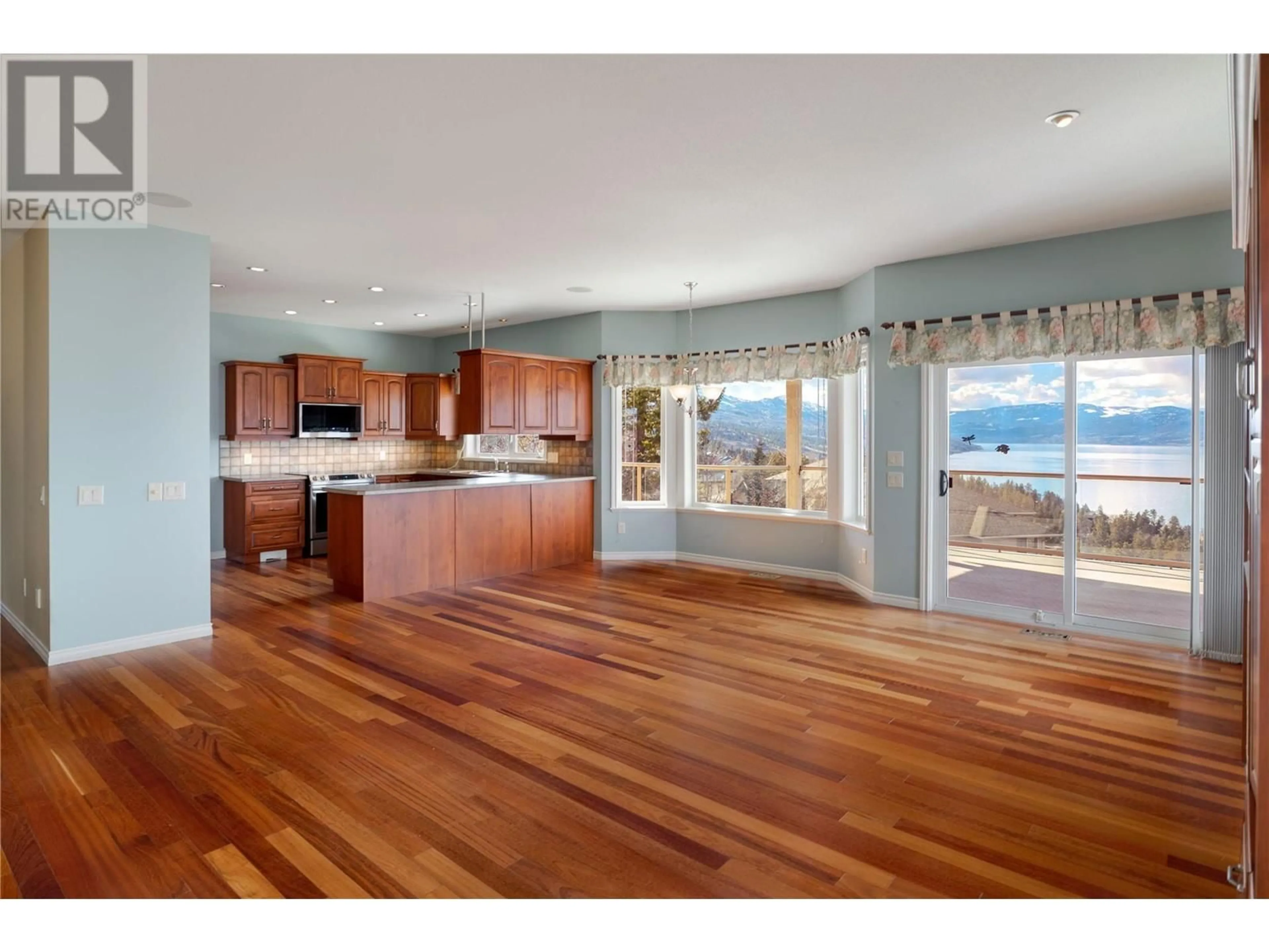 Open concept kitchen, wood/laminate floor for 453 Curlew Drive Lot# 1, Kelowna British Columbia V1W4L2