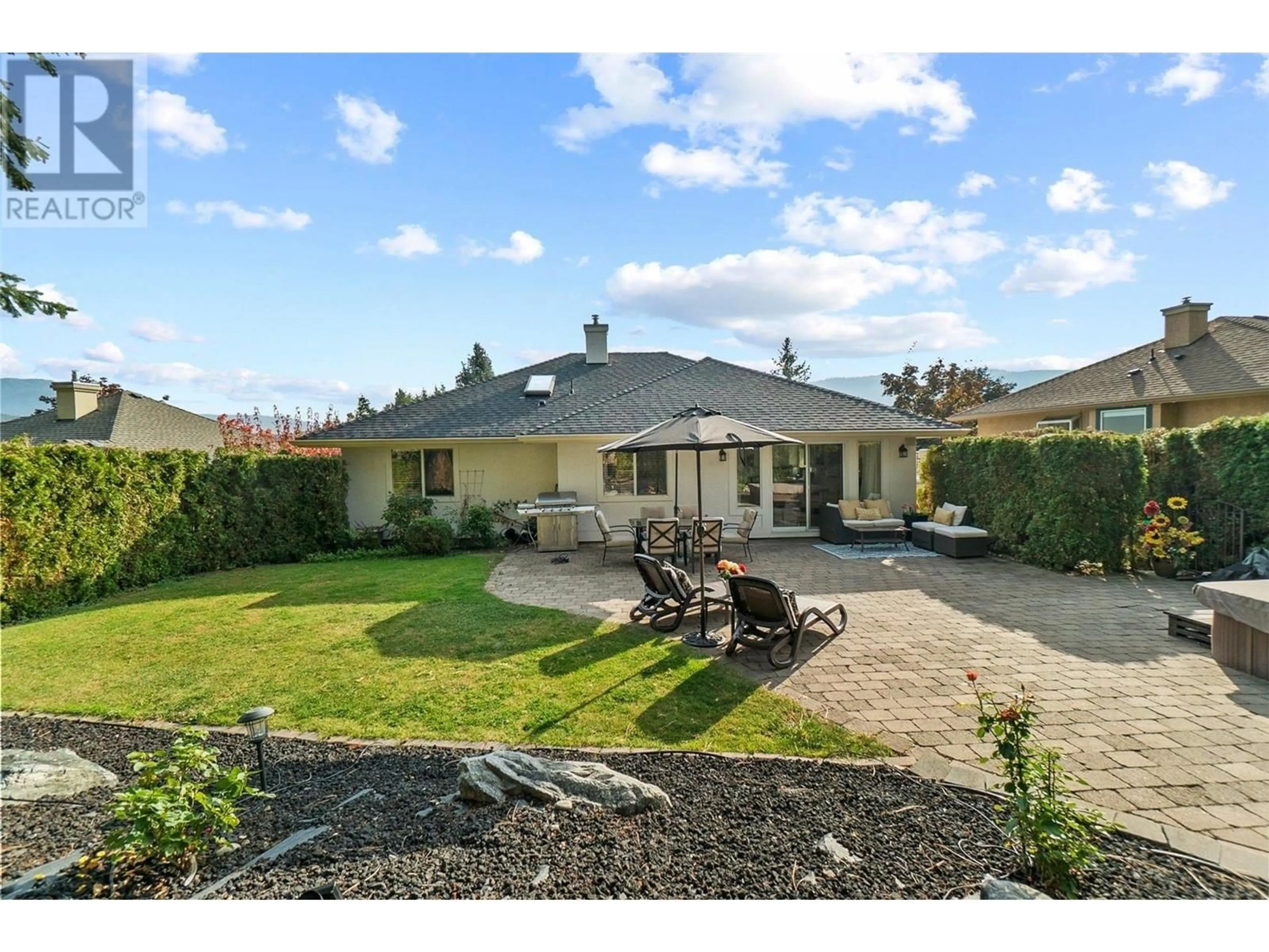 A pic from outside/outdoor area/front of a property/back of a property/a pic from drone, street for 3941 Gallaghers Circle, Kelowna British Columbia V1W3Z9