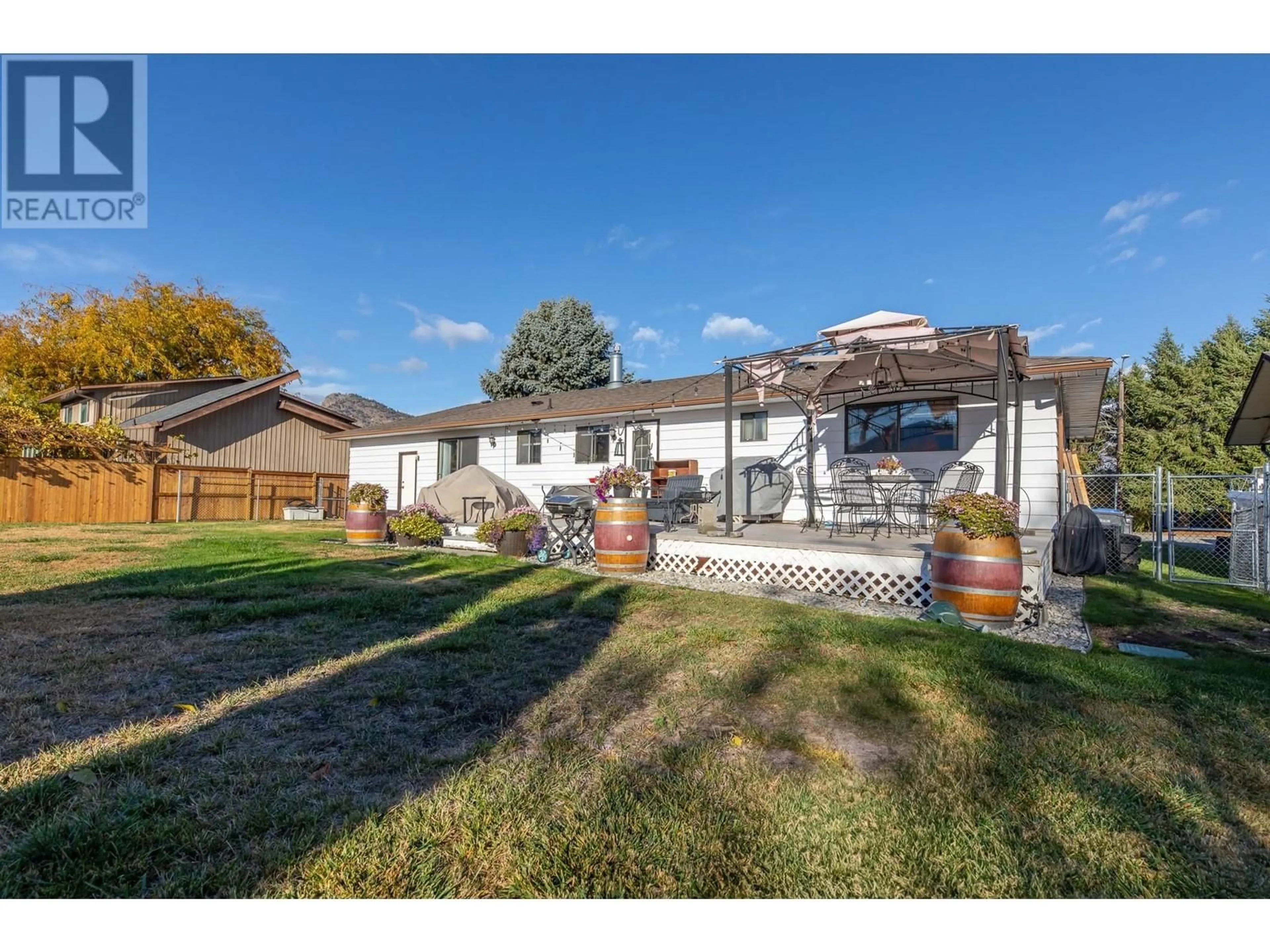 A pic from outside/outdoor area/front of a property/back of a property/a pic from drone, street for 1507 HARDING STREET, Summerland British Columbia V0H1Z9