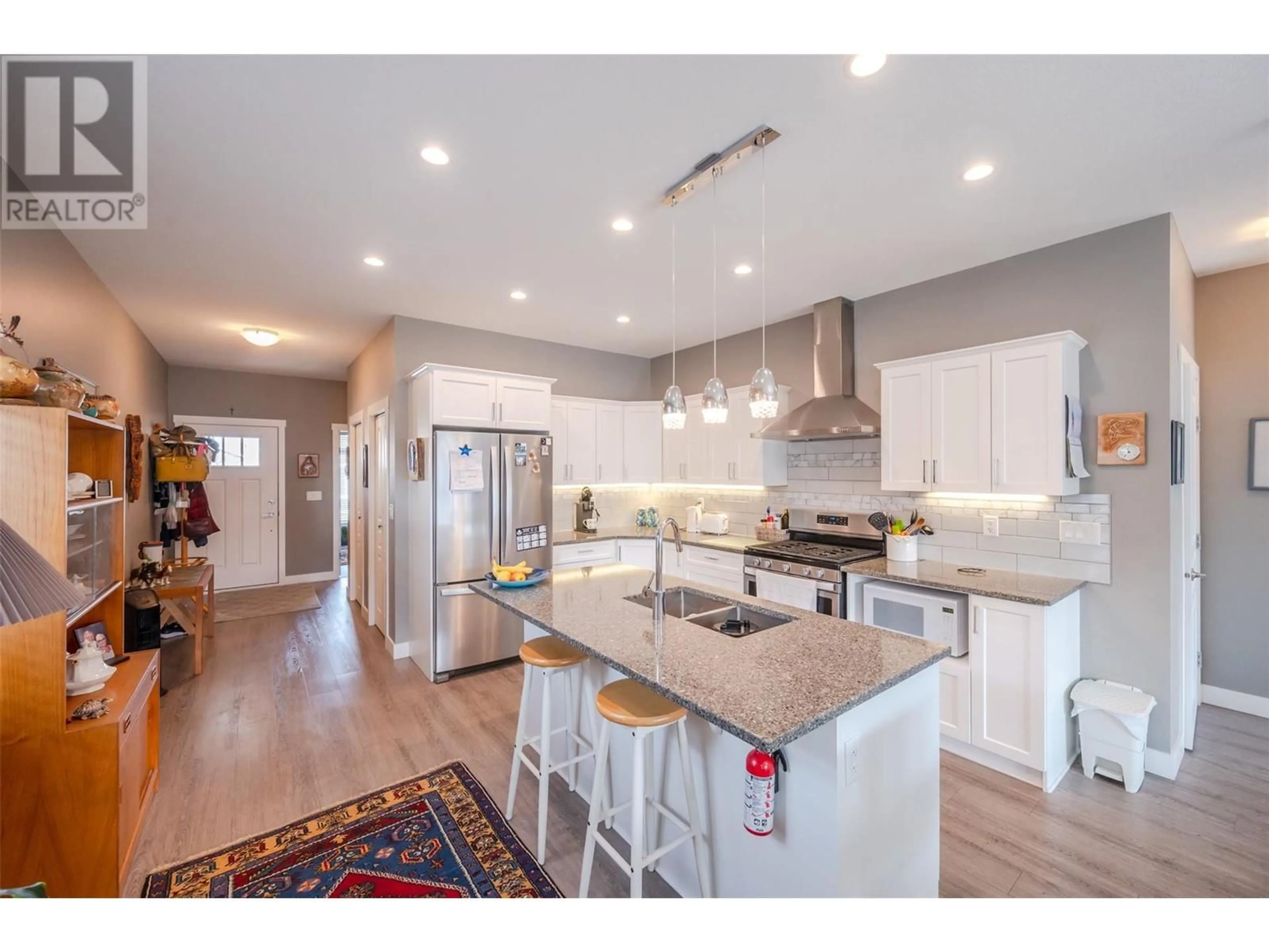 Open concept kitchen, wood/laminate floor for 351 Warren Avenue W Unit# 41, Penticton British Columbia V2A3N2