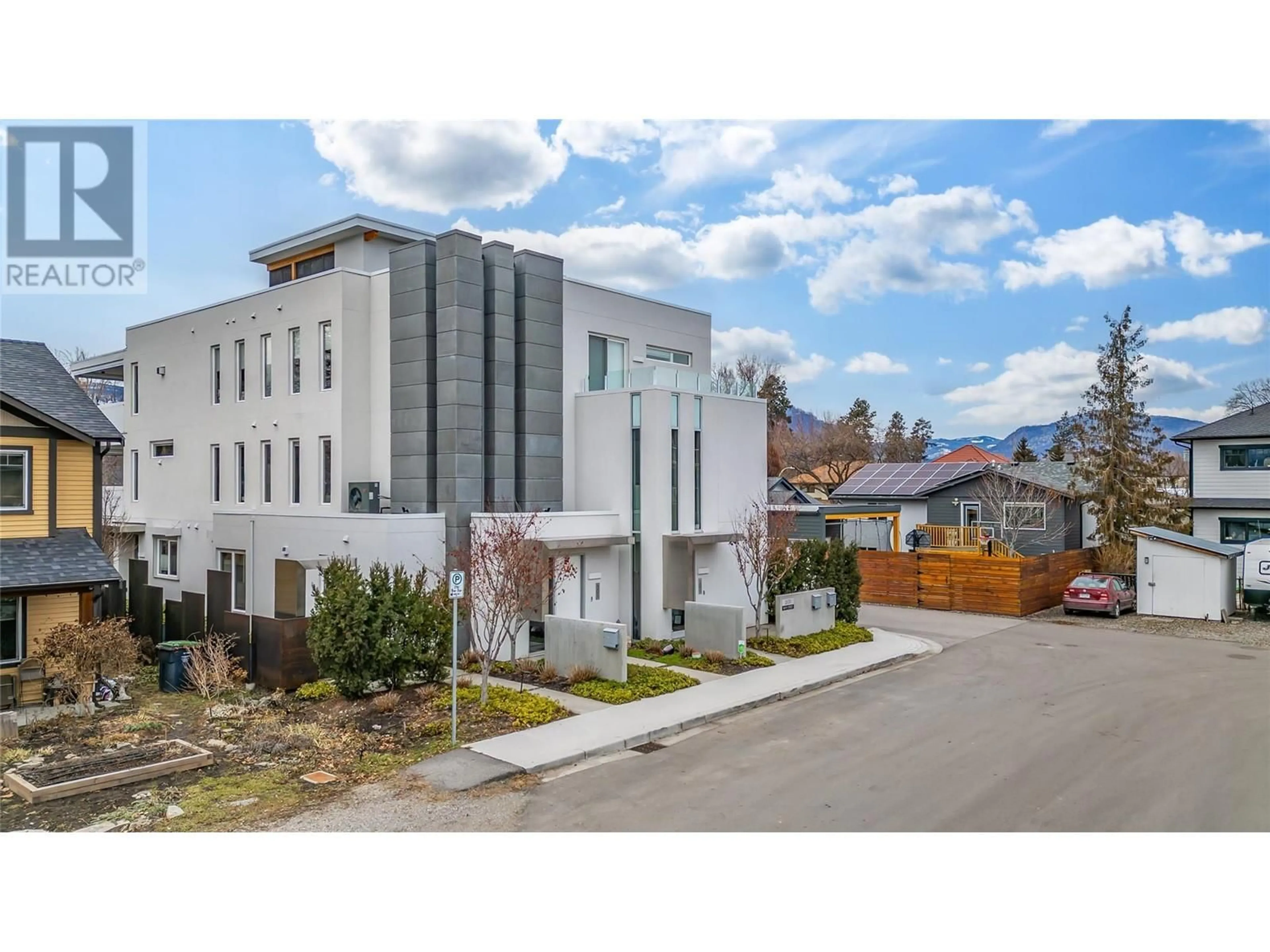 A pic from outside/outdoor area/front of a property/back of a property/a pic from drone, street for 2630 Bath Street Unit# 201, Kelowna British Columbia V1Y1M2