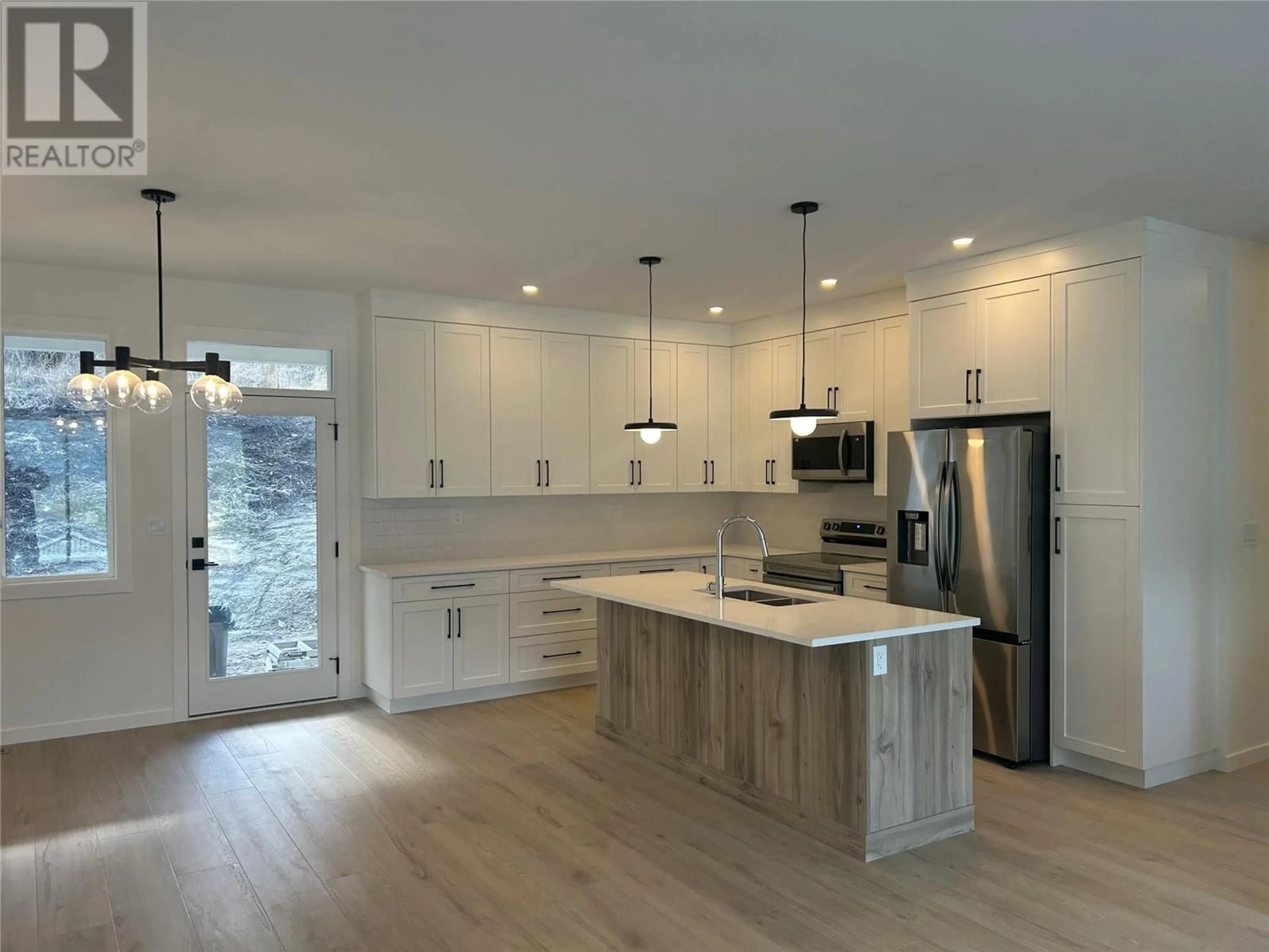 Open concept kitchen, wood/laminate floor for 1225 MONTGOMERY PLACE, Chase British Columbia V0E1M0
