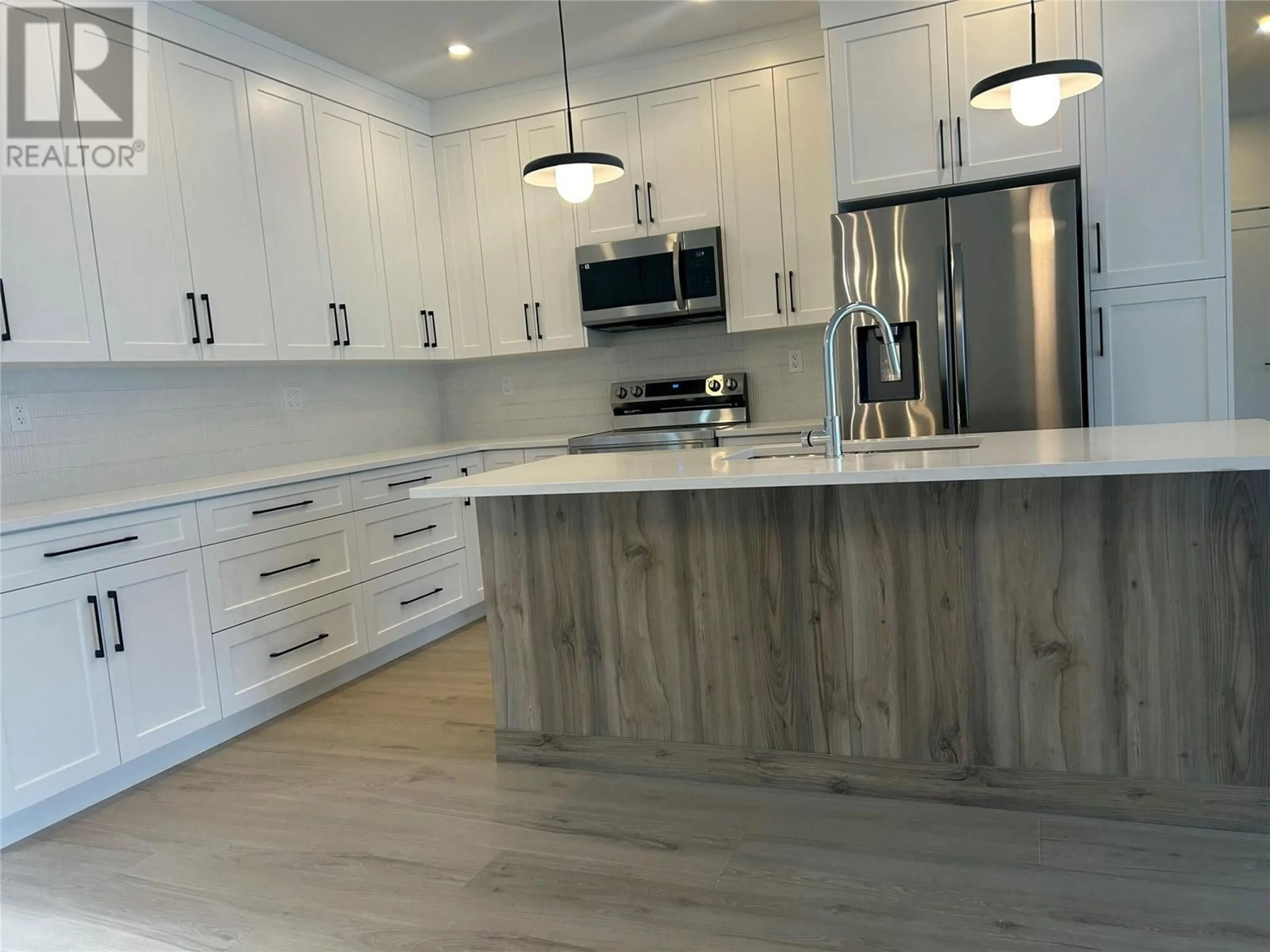 Open concept kitchen, wood/laminate floor for 1225 MONTGOMERY PLACE, Chase British Columbia V0E1M0