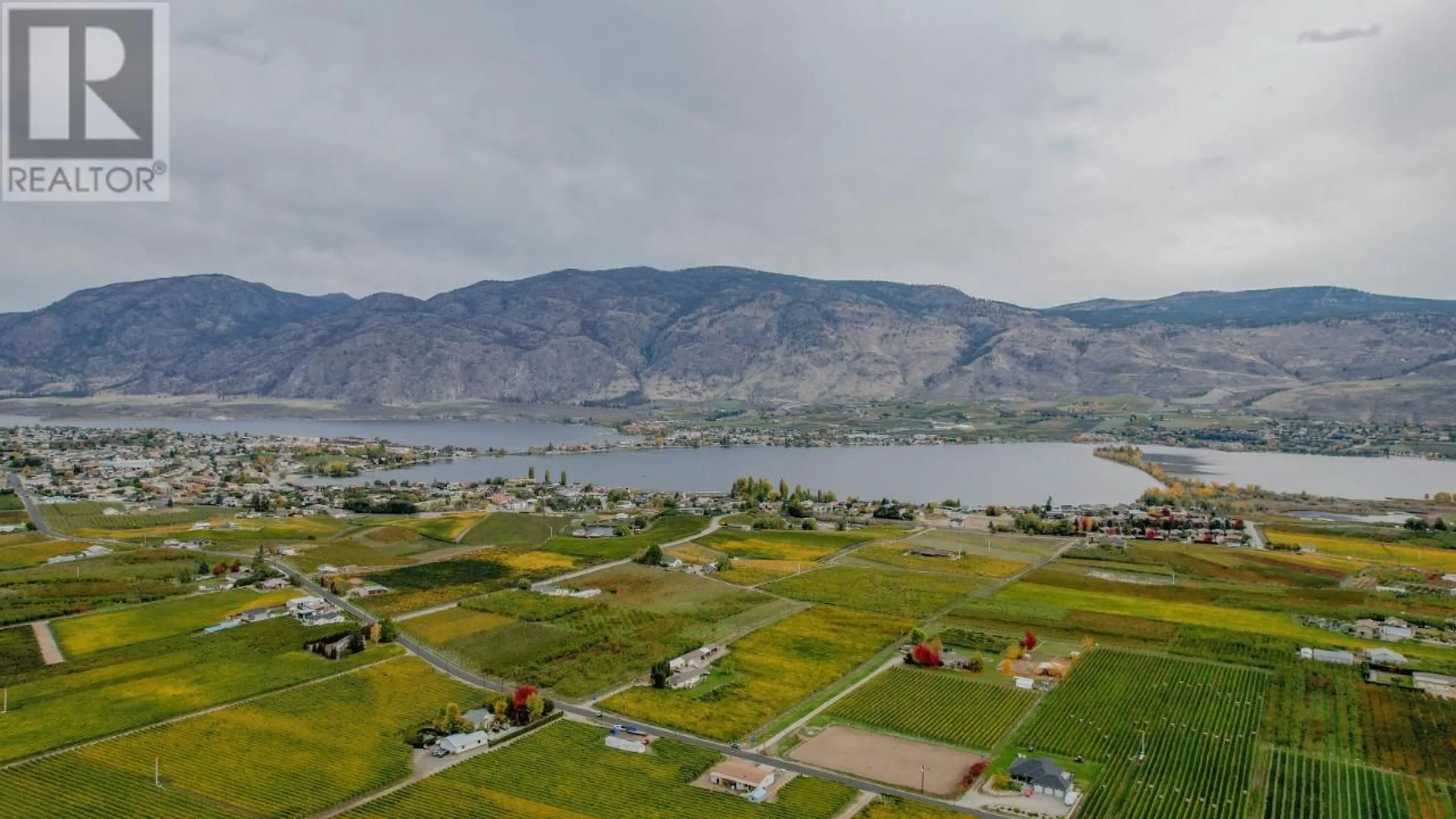 A pic from outside/outdoor area/front of a property/back of a property/a pic from drone, water/lake/river/ocean view for 3405 107TH STREET, Osoyoos British Columbia V0H1V4