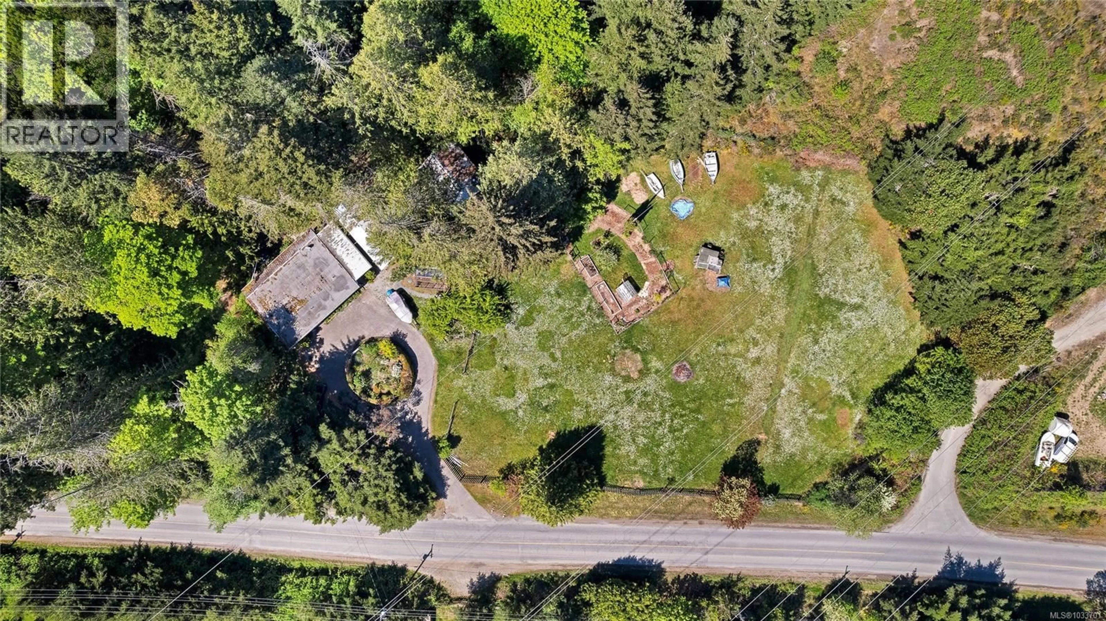A pic from outside/outdoor area/front of a property/back of a property/a pic from drone, street for 490 RAINBOW ROAD, Salt Spring British Columbia V8K2M5