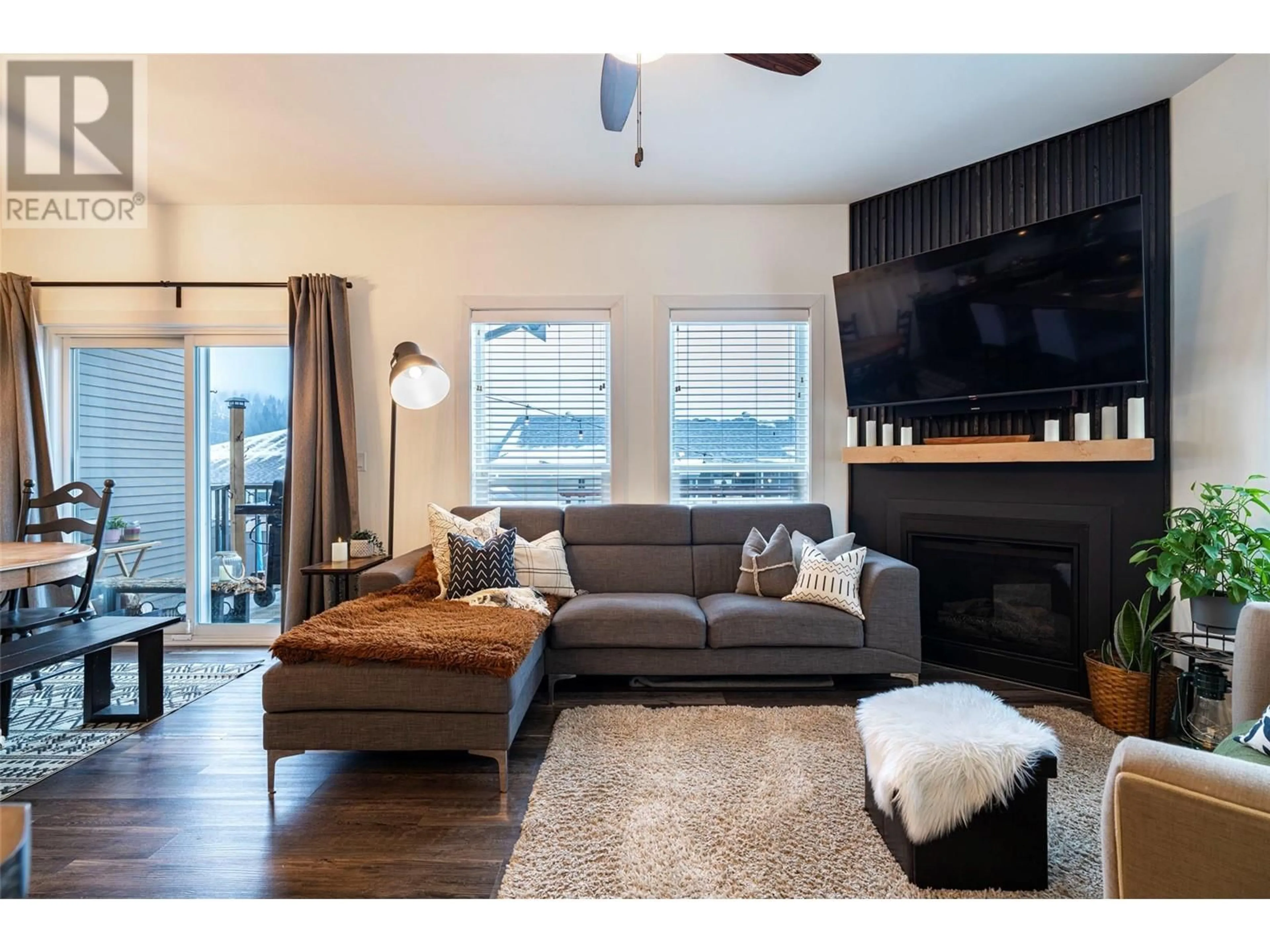 Living room with furniture, wood/laminate floor for 107 - 173 SALMON ARM DRIVE, Enderby British Columbia V0E1V1