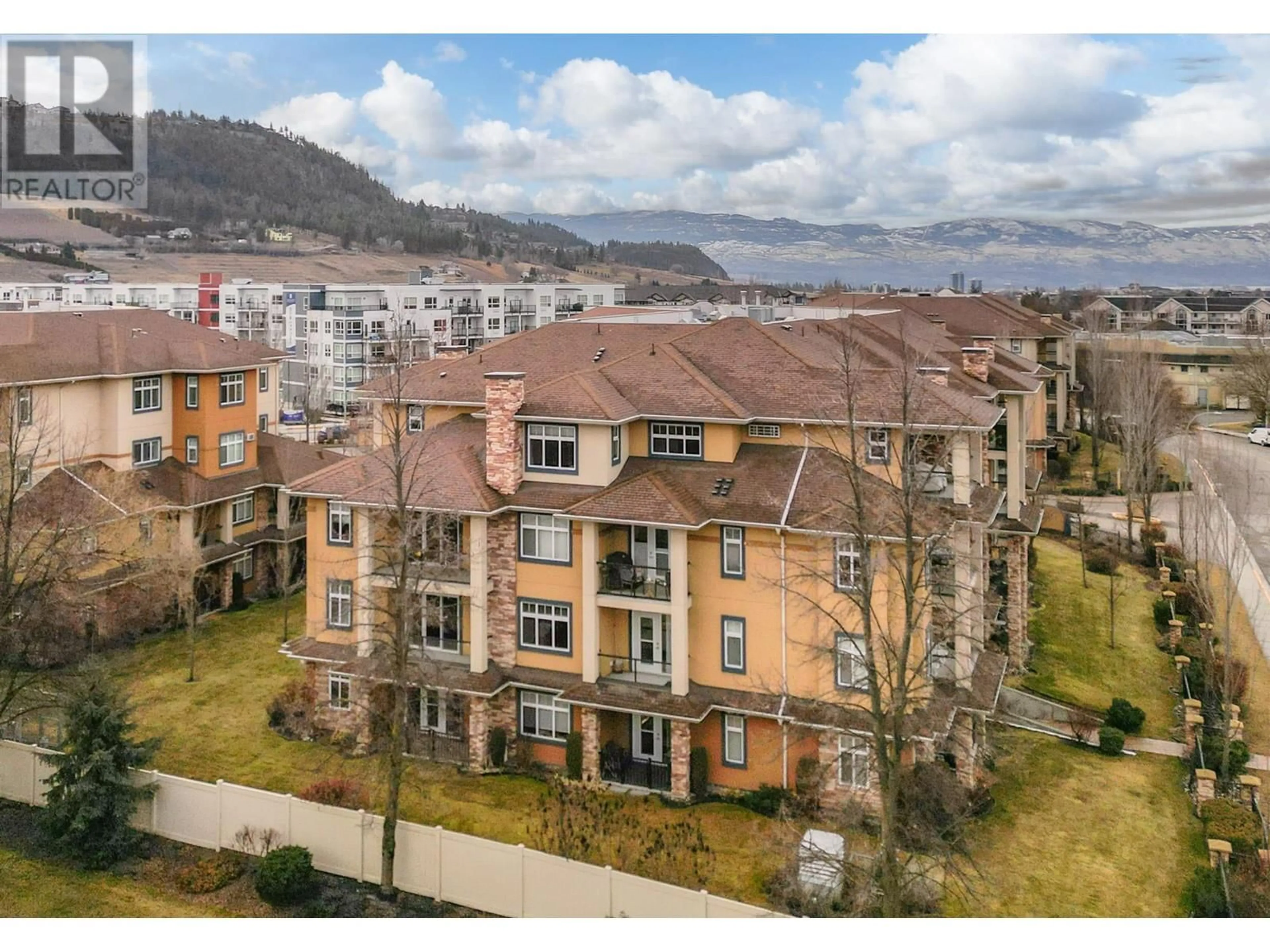 A pic from outside/outdoor area/front of a property/back of a property/a pic from drone, water/lake/river/ocean view for 305 Whitman Road Unit# 207, Kelowna British Columbia V1V2P3