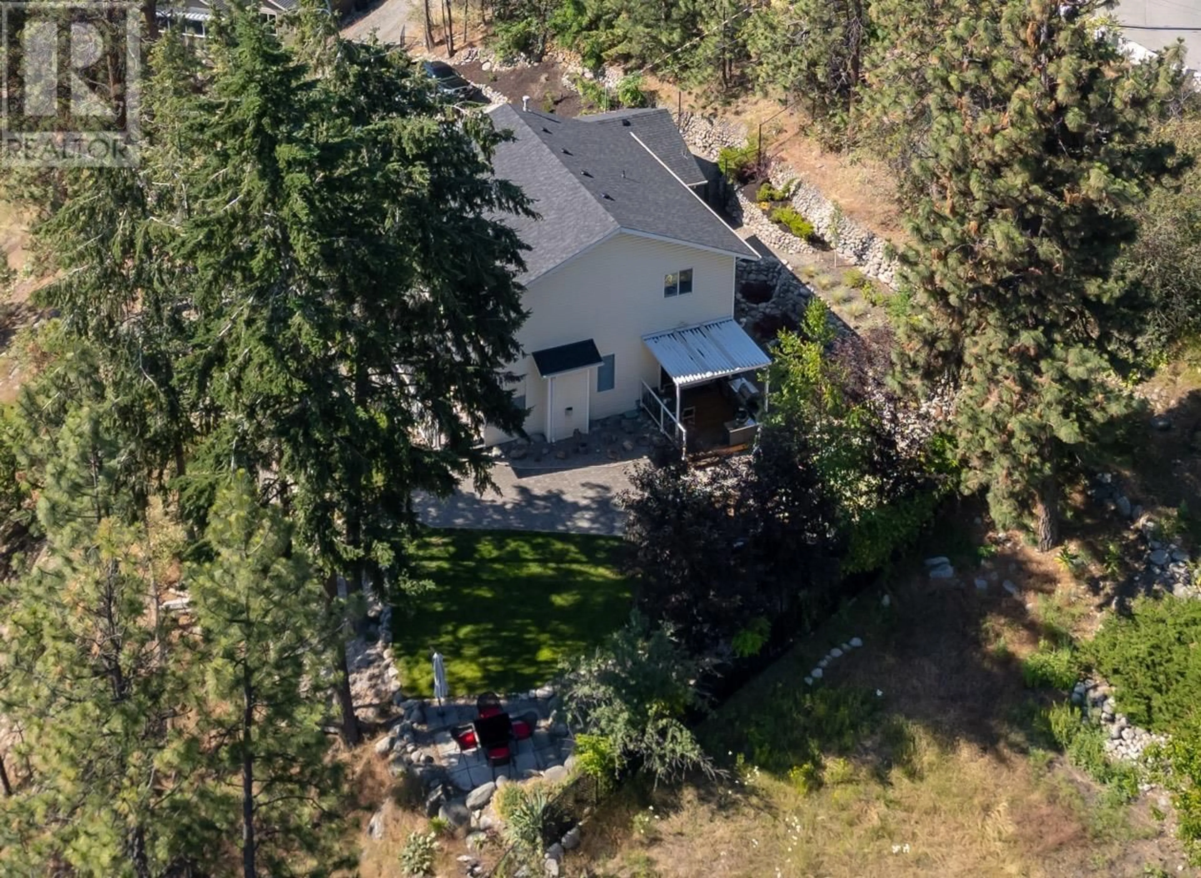 A pic from outside/outdoor area/front of a property/back of a property/a pic from drone, forest/trees view for 4123 PONDEROSA DRIVE, Peachland British Columbia V0H1X5