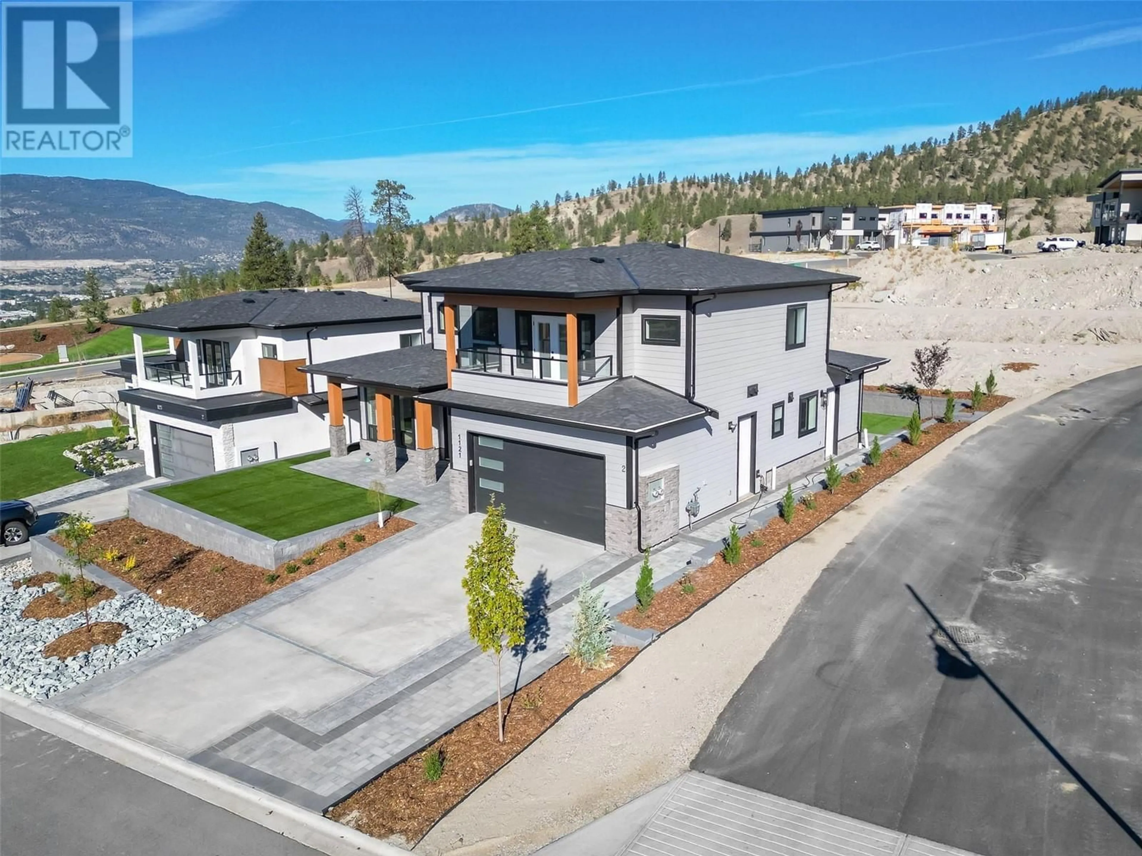 A pic from outside/outdoor area/front of a property/back of a property/a pic from drone, mountain view for 1121 ANTLER Drive, Penticton British Columbia V2A0C9