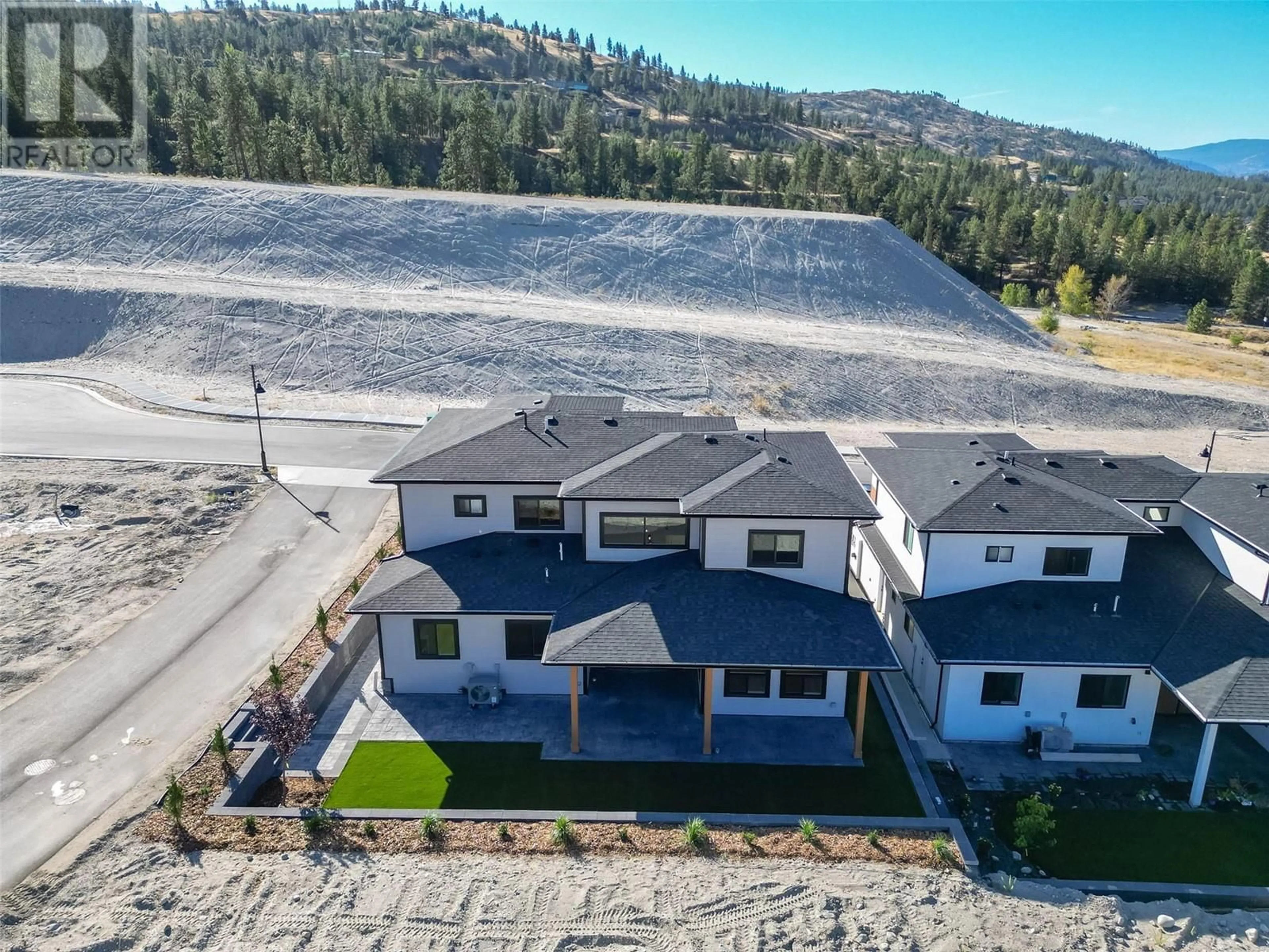 A pic from outside/outdoor area/front of a property/back of a property/a pic from drone, mountain view for 1121 ANTLER Drive, Penticton British Columbia V2A0C9