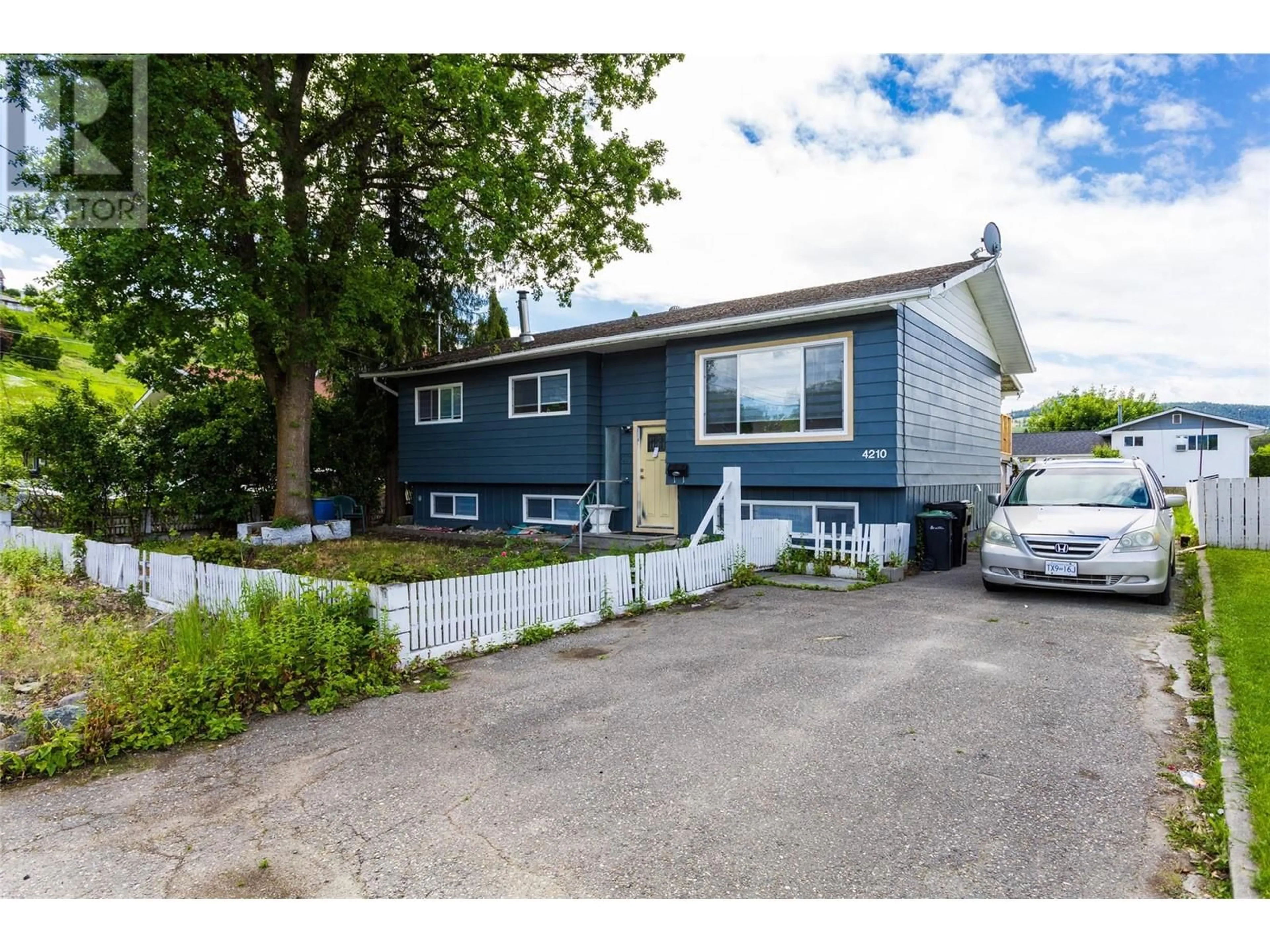 Home with vinyl exterior material, street for 4210 17 AVENUE, Vernon British Columbia V1T7K8