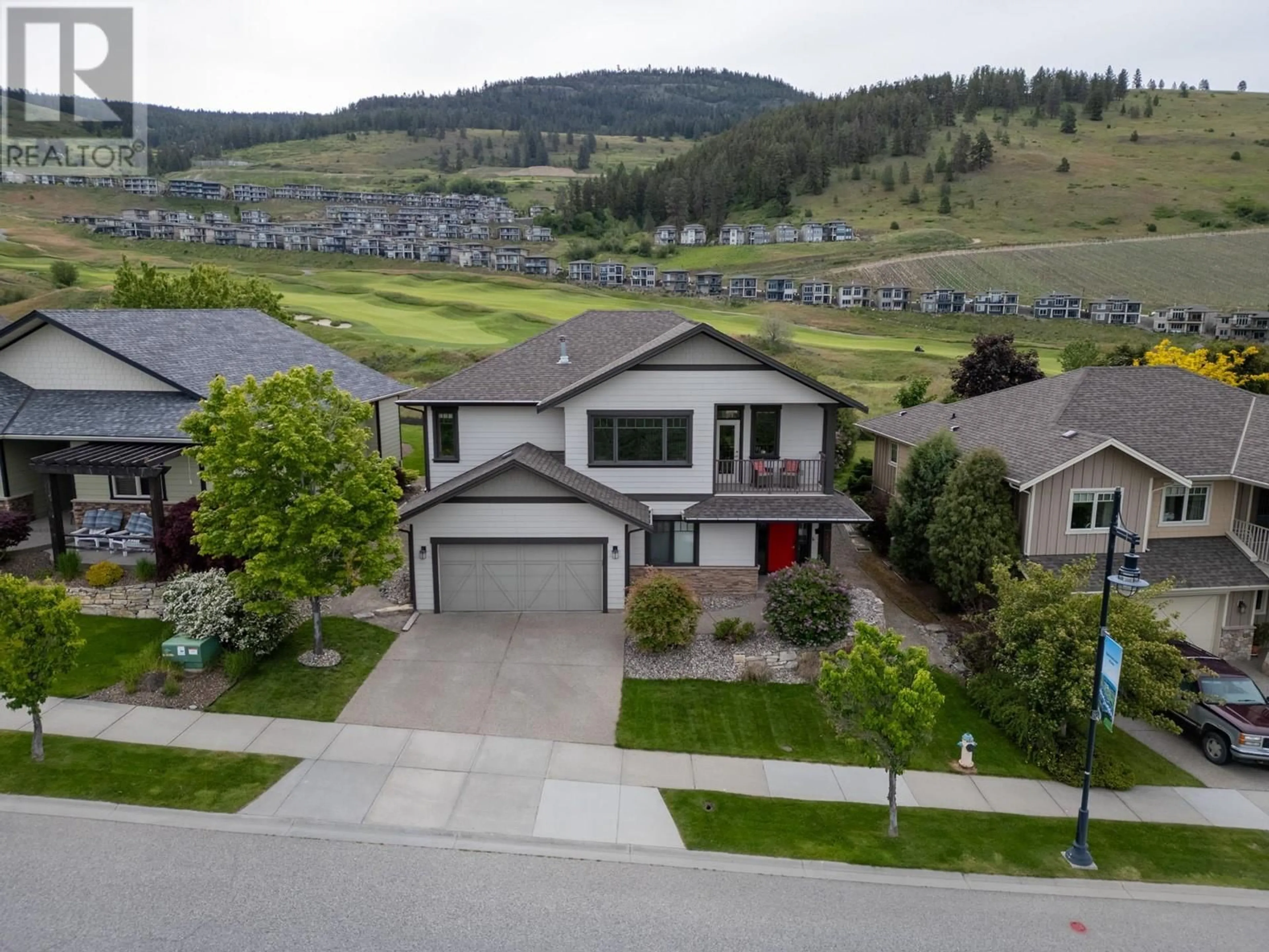 A pic from outside/outdoor area/front of a property/back of a property/a pic from drone, mountain view for 1585 TOWER RANCH BOULEVARD, Kelowna British Columbia V1P1P9