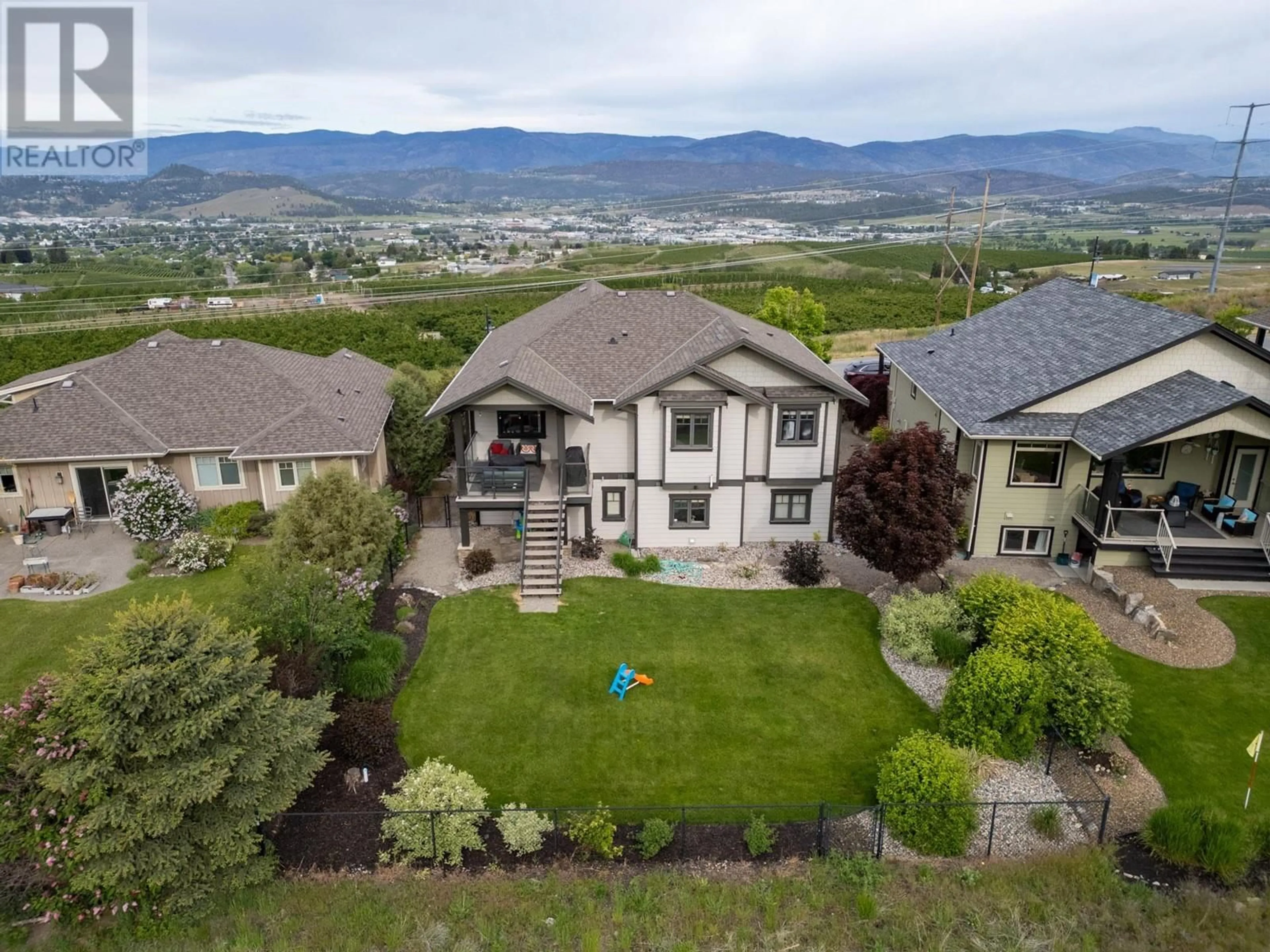 A pic from outside/outdoor area/front of a property/back of a property/a pic from drone, mountain view for 1585 TOWER RANCH BOULEVARD, Kelowna British Columbia V1P1P9