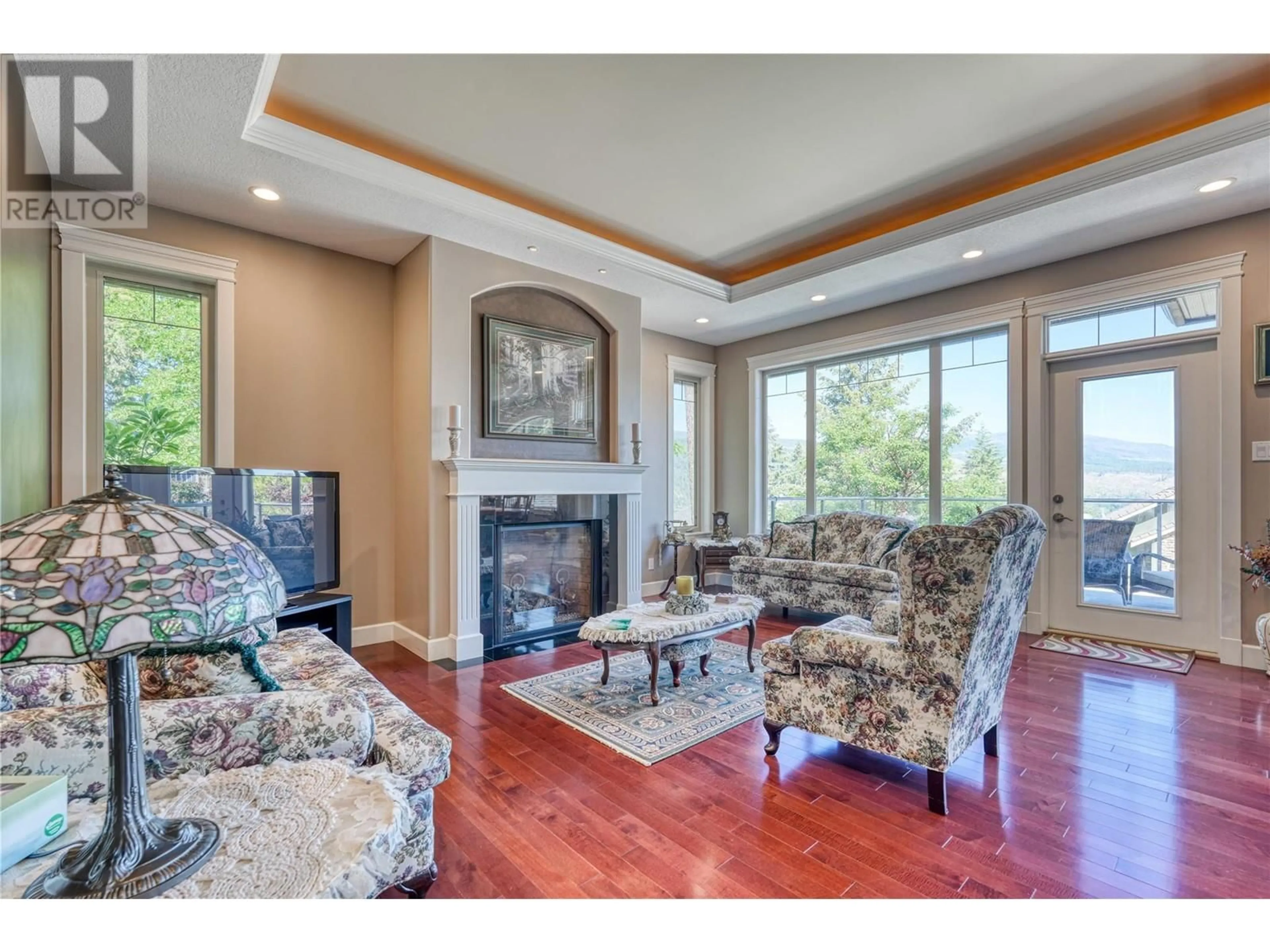 Living room with furniture, wood/laminate floor for 30 - 40 KESTREL PLACE, Vernon British Columbia V1H1S6