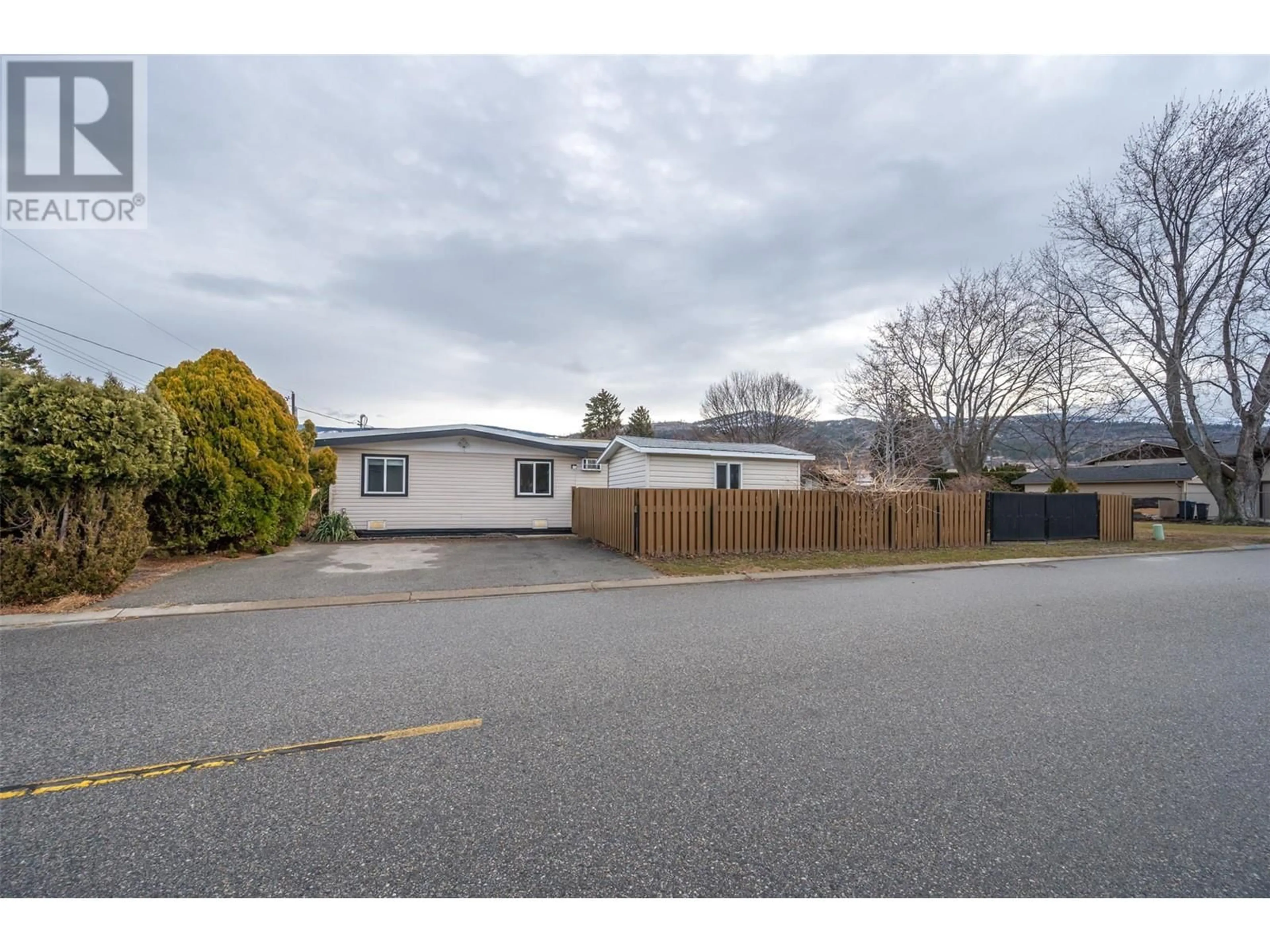 A pic from outside/outdoor area/front of a property/back of a property/a pic from drone, street for 156 McCulloch Drive, Penticton British Columbia V2A3P7