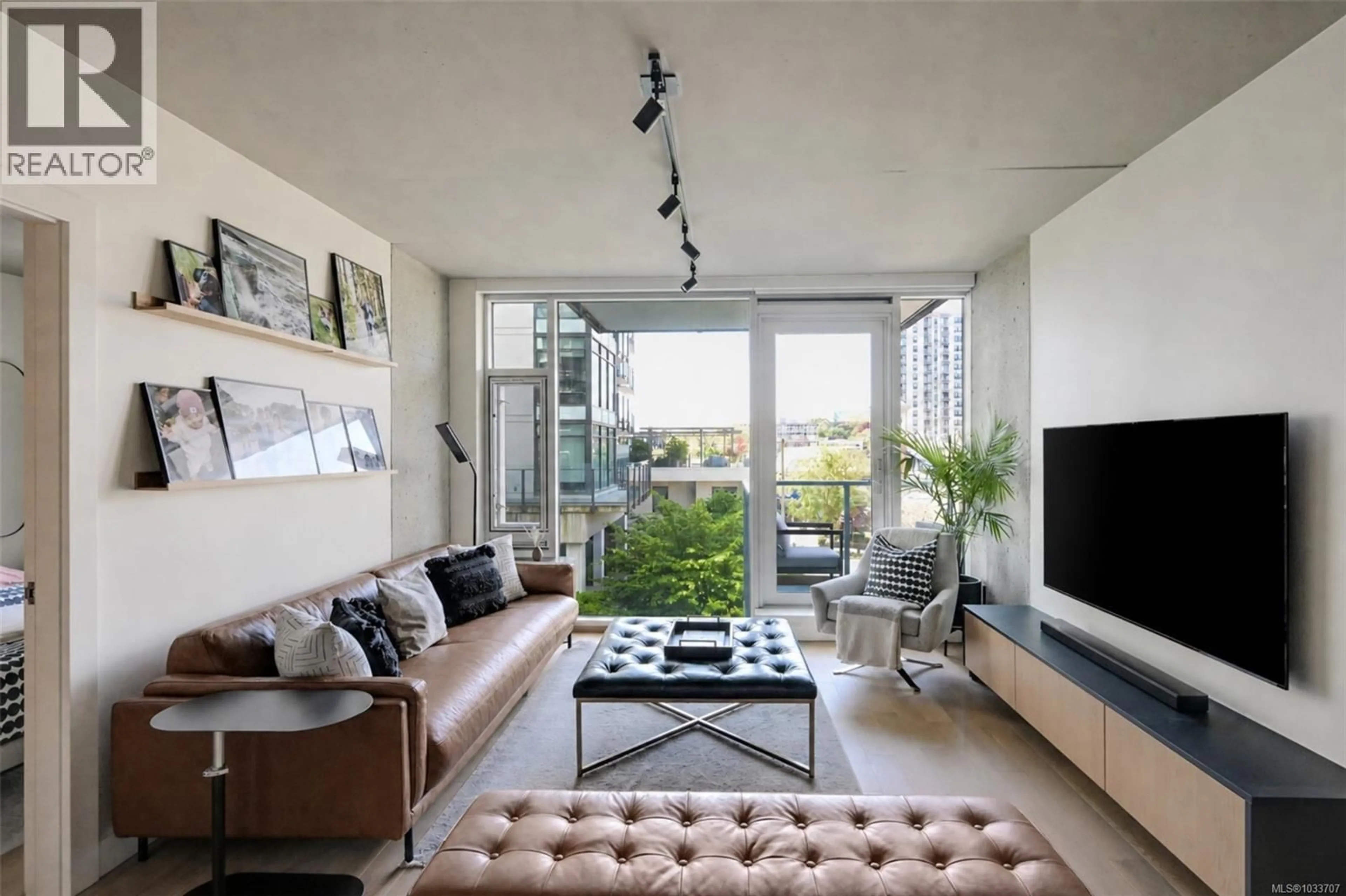 Living room with furniture, cement floor for 301 - 989 JOHNSON STREET, Victoria British Columbia V8V0E3