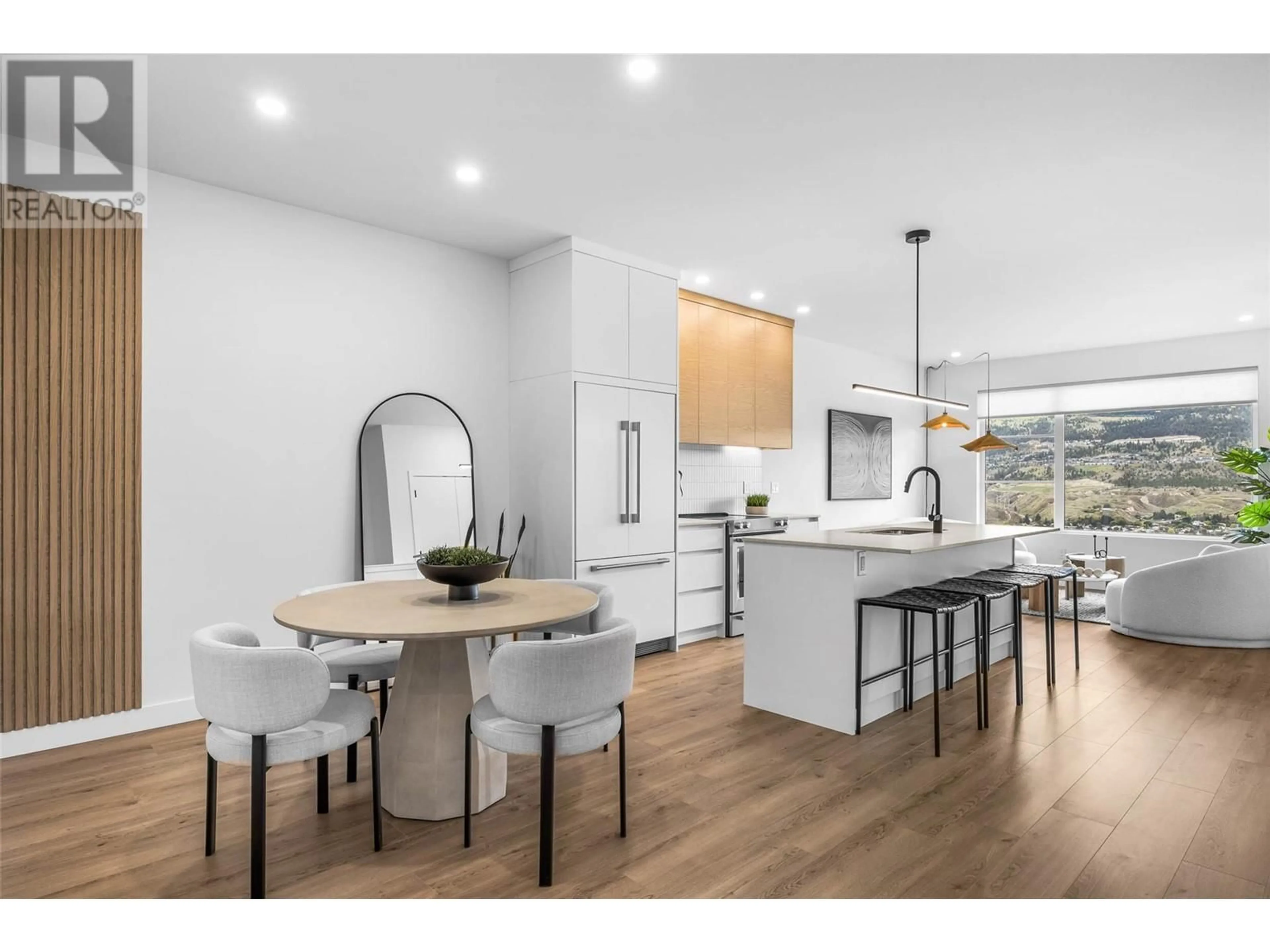 Open concept kitchen, wood/laminate floor for 5038 SUN RIVERS DRIVE, Kamloops British Columbia V2H0E7