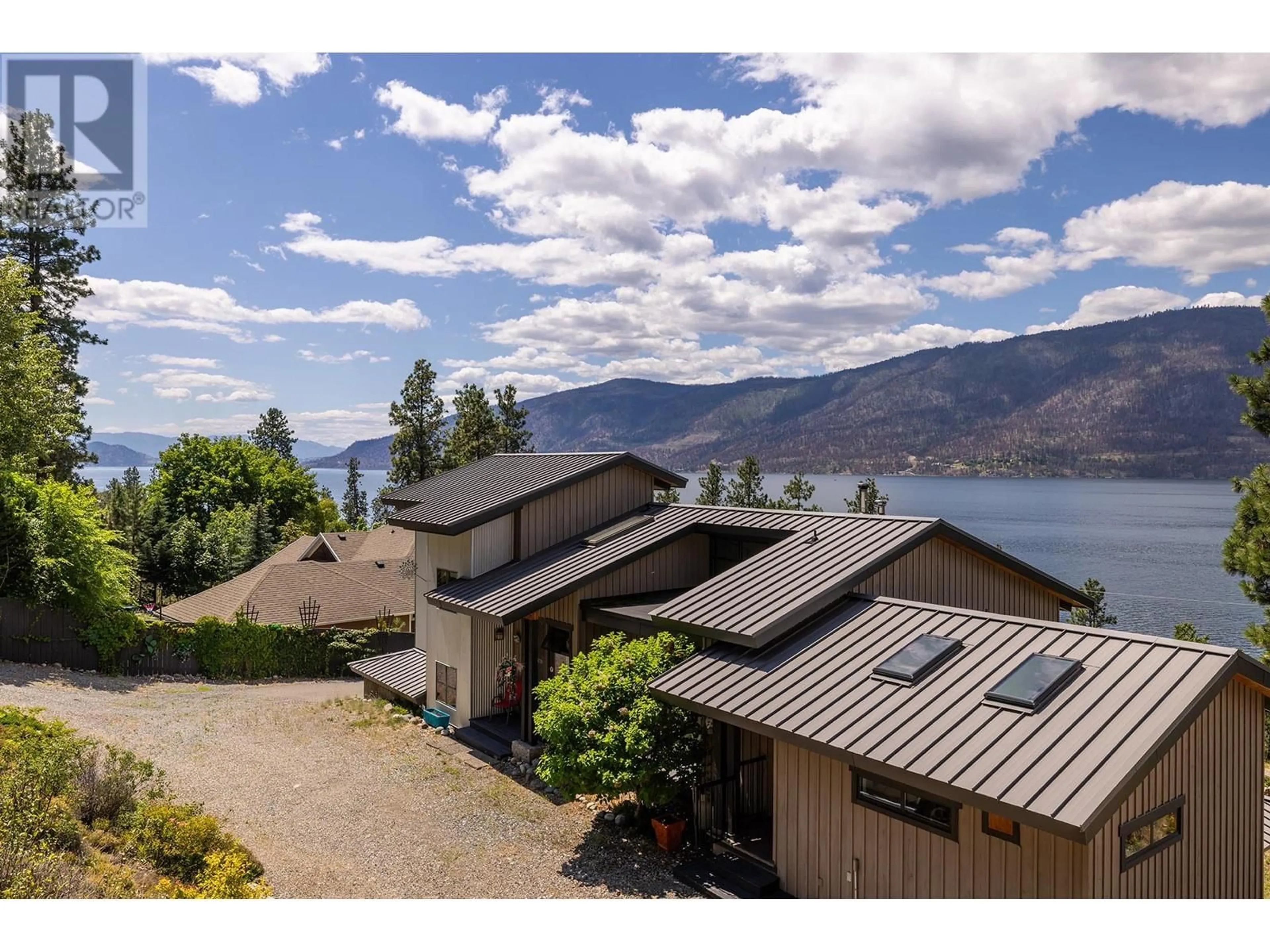 A pic from outside/outdoor area/front of a property/back of a property/a pic from drone, water/lake/river/ocean view for 10145 OKANAGAN CENTRE ROAD WEST, Lake Country British Columbia V4V2J4